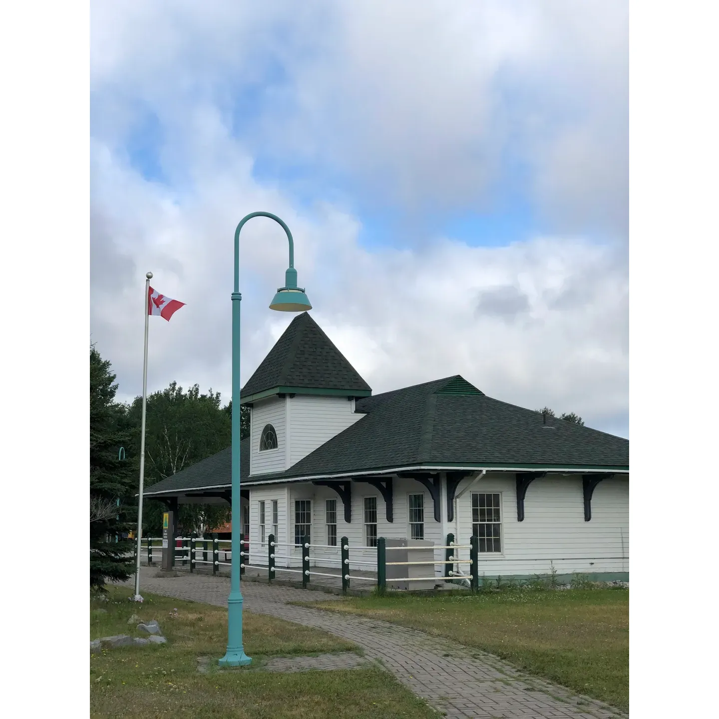 The Unofficial Cyclists Campground at the White River Tourist Information Centre offers a tranquil and accommodating haven for travelers trekking across Canada. Boasting a complimentary and peaceful resting spot, the grounds welcome visitors to set up tents and enjoy an undisturbed night under the starry sky. With ample picnic tables and benches available, visitors have the perfect setup for a serene outdoor meal or a restful pause. 

Families find delight in the playground, where children can expend their energy and play to their hearts' content. The area resonates with the charm of literary heritage, inviting guests to explore the local museum and statue homage to Winnie the Pooh, one of White River's most famous and beloved connections.

For those journeying in camper vans, the campground provides a secure and cheerful environment to stay overnight, enveloped by the calming embrace of nature. While positioned conveniently for a night's repose, the thoughtful placement of trees and greenery offers a subtle buffer from the distant hum of the highway.

Cyclists, in particular, express appreciation for the accessibility of the facilities, which include bathrooms for a refreshing break along their route. A source of potable water supports the need for hydration and replenishment, and the inclusion of a dumping station adds to the functionality of this welcoming outpost.

The Unofficial Cyclists Campground underscores the desire among travelers for simple, no-fuss locations that cater to those on extended journeys. The availability of essential services emphasizes the thoughtful consideration given to visitors seeking a momentary retreat during their adventures across the magnificent Canadian landscape. Description by ChatGPT.