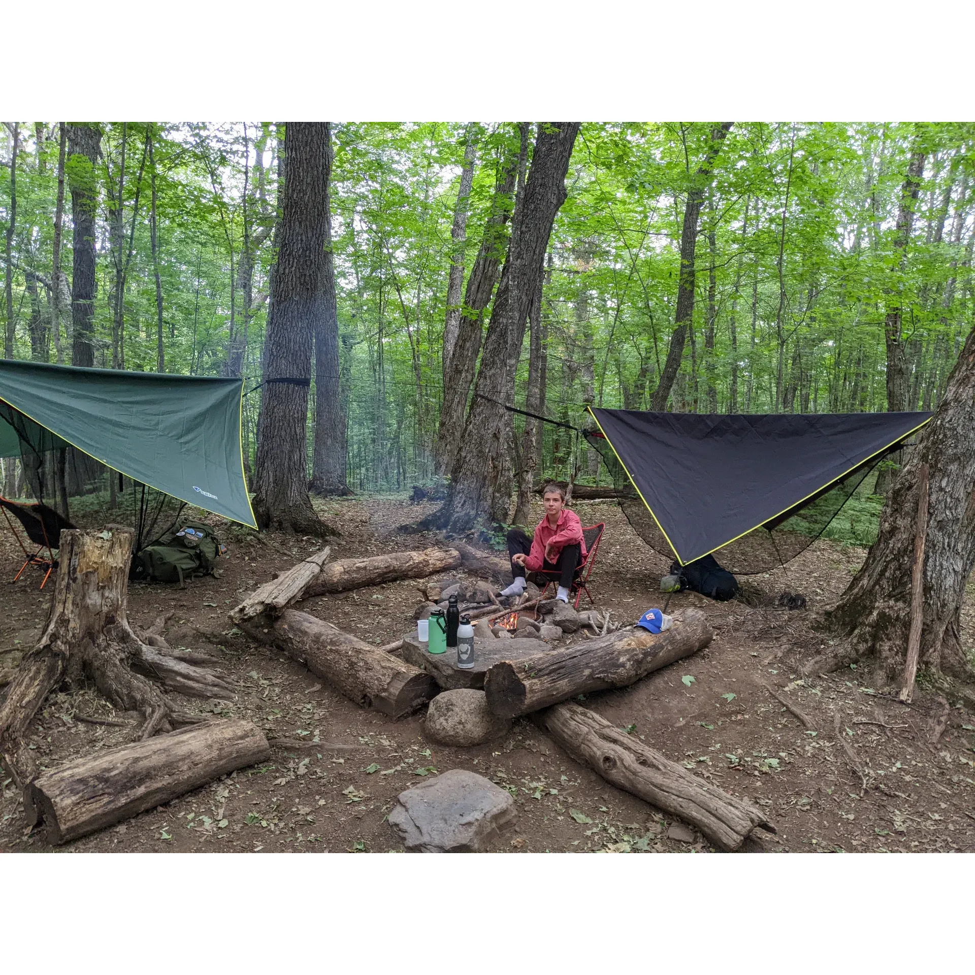 Island Mine Campground invites adventurers and nature lovers to a spacious and well-maintained habitat surrounded by the serene beauty of a lush maple forest. A true haven for those seeking tranquility, the campground offers the timeless joy of campfires with metal fire rings provided at each site, allowing guests to enjoy the crackling warmth of a fire under a canopy of stars.

Guests are encouraged to engage in the age-old ritual of gathering sticks and kindling to feed their fires, an activity that not only hones survival skills but also enhances the authentic camping experience. This outdoor retreat, with its open and expansive campsites, is perfect for those looking to immerse themselves in the great outdoors while still having access to the basic comforts of a well-kept campground.

The babbling creek that runs near the campsites offers a unique element to the camping experience, and despite its humble appearance, provides water with a natural purity that guests have found satisfactory. For explorers interested in a modest hike, the remnants of a bygone train operation can be discovered nearby, adding a sense of history and mystery to the surrounding wilderness.

Whether seeking a peaceful escape in nature, an outdoor family adventure, or simply a pitstop during island explorations, Island Mine Campground presents an enchanting backdrop that captures the heart of camping without the distractions of a bustling environment. Here, the simplicity of nature is the main attraction, allowing guests to unwind and connect with the environment in a setting that offers a timeless camping experience. Description by ChatGPT.