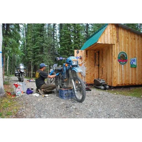 Thompson's Eagle Claw Motorcycle Park is a premier destination for motorcycle enthusiasts looking for a comfortable and unique outdoor experience in Tok, Alaska. With its strategic location just a couple of miles south of the junction of Highways 2 and 1, it offers easy access while providing a tranquil getaway among the serene pines. The park caters specifically to the needs of riders, offering an array of accommodation options from well-maintained campsites complete with tables, chairs, and fire pits, to cozy cabins and even the novelty of converted vehicles such as a school bus and an ambulance, for a memorable night's rest.

The campground is renowned for its hospitality, thanks to the amiable and attentive host Vanessa, who goes above and beyond to ensure guests enjoy their stay. Alongside basic necessities, the park boasts a range of amenities designed with the motorcyclist in mind. Riders can find solace in the outdoor kitchen area, unwind in the wood-fired sauna, or take advantage of the on-site workshop, complete with tools and a covered area perfect for bike maintenance and repairs.

The atmosphere at Thompson's Eagle Claw Motorcycle Park is one of community and camaraderie, particularly around the communal fire pits, where stories and experiences are shared under the Alaskan sky. The park offers a genuine experience that blends the rustic charm of outdoor camping with the specific comforts and conveniences that motorcyclists appreciate.

For those looking to "rough it" while still enjoying the essentials, and perhaps even a little luxury like a sauna, the park delivers. And with thoughtful planning evident in every corner of the well-structured campsite, guests can look forward to a specialized and unforgettable experience tailored to their adventurous spirit. Whether stopping through Tok on a grand journey, seeking a peaceful retreat, or requiring a convenient workshop to tune up the ride, Thompson's Eagle Claw Motorcycle Park stands out as a top choice for riders traversing the Alaskan wilderness. Description by ChatGPT.