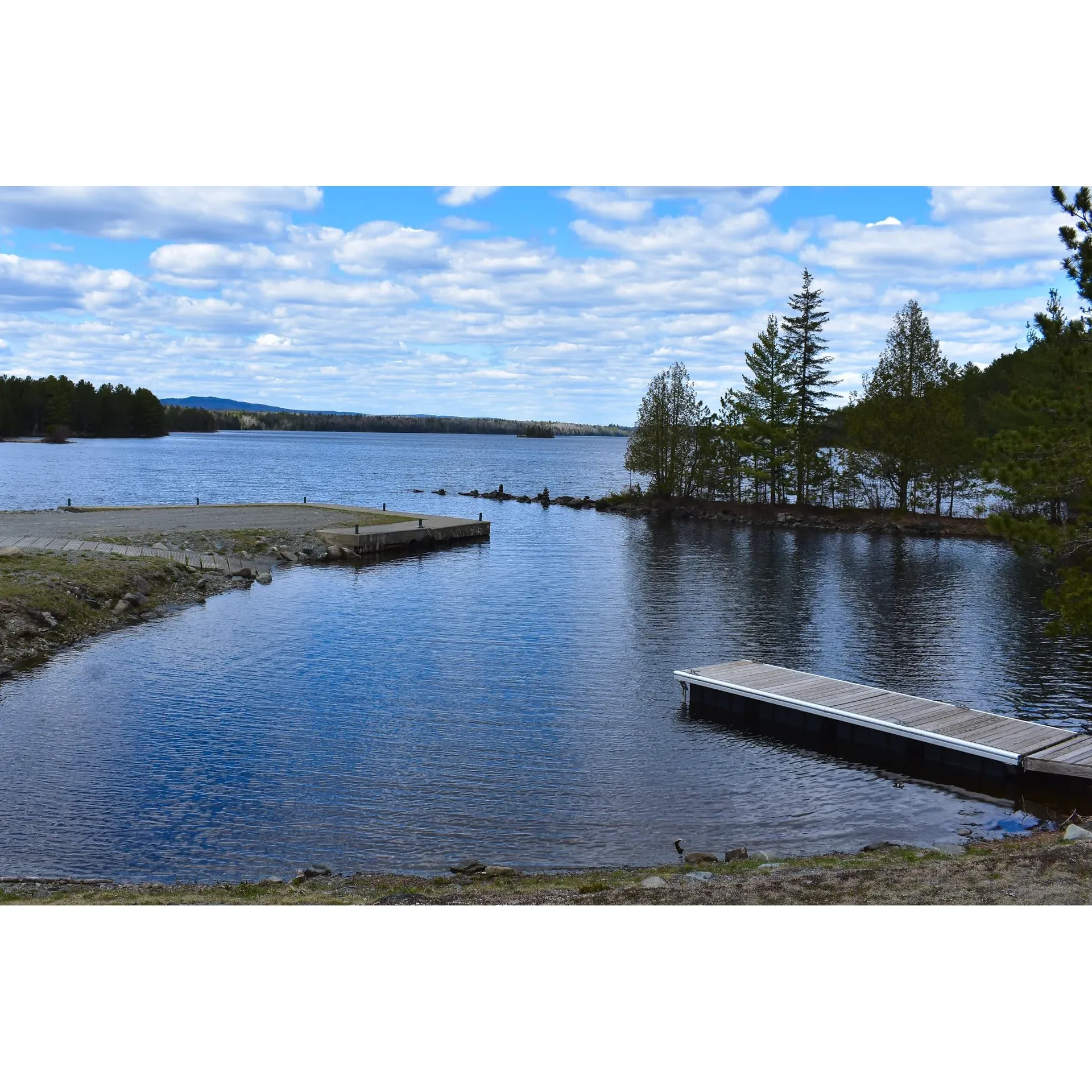 Indian Pond Campground presents itself as a slice of outdoor heaven, offering visitors an authentic camping experience immersed in the beauty of Maine's rugged terrain. Welcoming its guests with a smoothly maintained dirt road, this camping destination impresses upon arrival, setting the scene for an unforgettable stay amidst pristine nature.

Eager to accommodate and assist, the staff at Indian Pond Campground highlights their commitment to guest satisfaction, providing a level of service that brings visitors back time and again, eager to relive the adventure. The campsites at this campground are thoughtfully designed to enhance the camping experience, providing ample space and an innovative layout that promotes family fun and togetherness during the balmy summer months.

Patrons of Indian Pond Campground frequently express their delight with the camping accommodations, describing them as epitomizing true outdoor living. With the campground being a stone's throw from a plethora of recreational hot spots, the location becomes an adventurers' junction for an array of exciting escapades.

Nature is always within reach here, where a serene pond provides the perfect backdrop for wildlife sightings—visitors might catch a glimpse of a loon gracefully gliding near the shoreline. Despite being in the heart of the Maine woods, the campground ensures wildlife cohabitation is managed responsibly, featuring bear-proof waste containers to maintain the pristine condition of the environment.

Offering a tranquil retreat, Indian Pond Campground is graced with secluded sites that guarantee privacy while still affording close access to the alluring shore and convenient boat launch. This idyllic setting, offering a fusion of solitude and natural connectivity, ensures that each stay is as peaceful as it is memorable. It’s a place where one can expect the serenity of the wilderness, amply paired with the amenities that make for a hassle-free camping journey, creating a perfect outdoor retreat that's simply hard to beat. Description by ChatGPT.