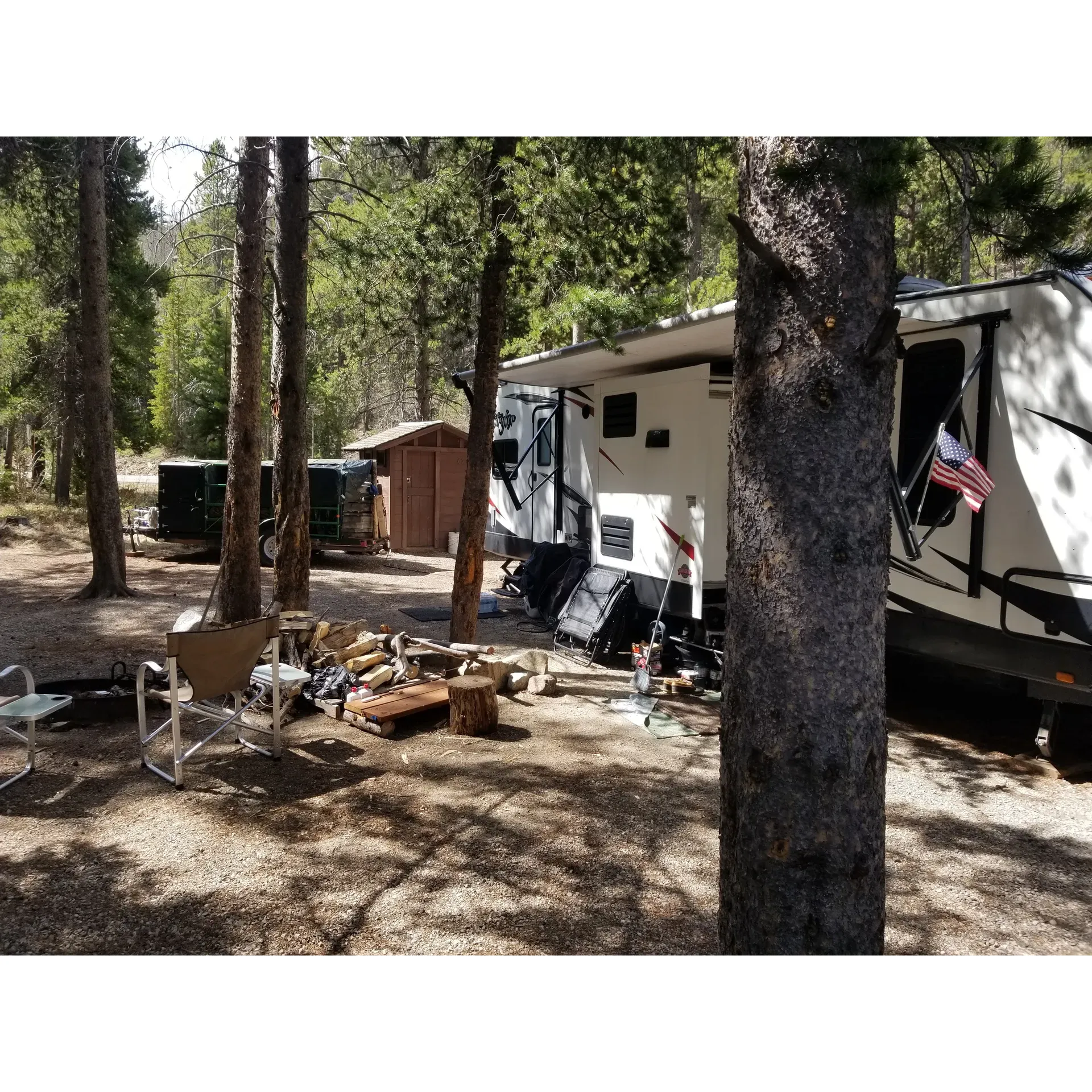 Basin Campground offers well-maintained campsites that provide visitors with a serene and tranquil outdoor experience close to the gentle flow of a nearby river. The campground has taken the unique step of enhancing the traditional camping experience by installing motion-activated night lights in the outhouses, ensuring a blend of comfort and convenience for nighttime needs.

Guests who prefer to be accompanied by their canine companions will find Basin Campground to be a pet-friendly destination where even first-time dog campers can enjoy the great outdoors. The weather generally complements the camping experience, making tent stays a pleasurable affair, be it under starry skies or a light sprinkle, adding to the ambiance of a cozy night.

A mere stone's throw from the picturesque town of Red Lodge, this campground presents a collection of delightful small camp sites that accommodate an intimate connection with nature. A reputation for excellent upkeep extends to the washroom facilities which are consistently kept in pristine condition. The camp host's warm hospitality enhances the stay, offering both a friendly face and assistance when needed.

With the added allure of first-come-first-serve slots like the much-praised site #18, visitors can immerse themselves in a beautiful and peaceful night under the vast, open skies. Basin Campground is indeed an awesome place to camp for those seeking an escape into nature without sacrificing the little luxuries that make camping comfortable and carefree. Description by ChatGPT.