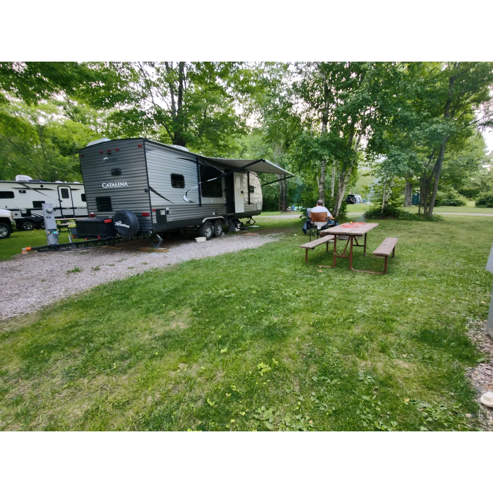 Summer Breeze Campground offers a serene and inviting retreat for campers looking for both adventure and relaxation. Upon arrival, even if just before closing, guests are welcomed by the friendly staff with open arms, a testament to their commitment to excellent service. The campground shines with its impeccably maintained amenities and clean, well-appointed facilities, including a standout shower room praised as the best along a traveler's extensive journey.

The campground boasts a variety of convenient on-site features catered to enhancing the overall guest experience. Visitors can indulge in a refreshing dip in the pristine in-ground pool, which serves as a perfect escape on a warm summer day. Families are well-cared for with a decent playground where the little ones can freely frolic, and the availability of firewood and ice at fair prices adds a touch of home comfort to the outdoor experience. 

Spaciousness is a hallmark at Summer Breeze Campground, with generous sites offering pull-through capabilities for trailers and ensuring that everyone has their slice of nature without feeling crowded. Peace and tranquility pervade the grounds, providing a quiet haven for relaxation.

Not just a retreat for leisure, the campground is also equipped with ample amenities for extended stays, making it suitable for those in town for work. The park's industrial-grade laundry facilities are an added convenience for guests looking to refresh during longer stays. Sports enthusiasts will revel in the volleyball net, basketball goal, and small playground, which includes a tether ball area, delivering outdoor fun for all ages.

A family-owned gem, Summer Breeze Campground’s diligent hosts exemplify true hospitality and hands-on care, constantly ensuring the environment is clean and welcoming. This delightful campground, situated in the central time zone, is notably accommodating with check-in times, ensuring that time zone differences never hinder the joyful start to a camping trip.

Indeed, whether looking for a brief retreat or a place to call home for a while, Summer Breeze Campground is a charming destination that promises to leave visitors longing for their next return. Description by ChatGPT.