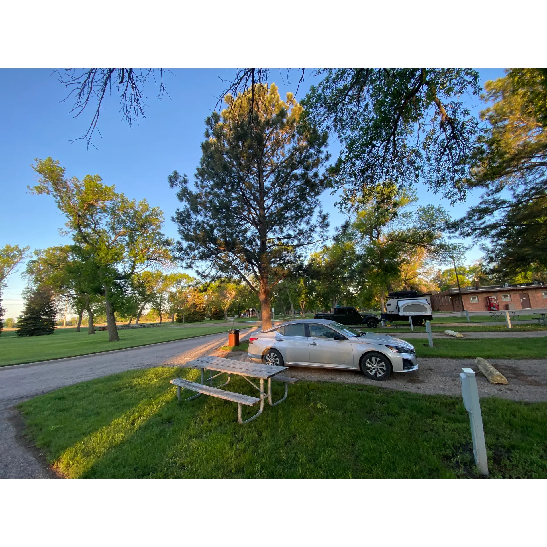 Melgaard Park Campground emerges as a charming camping spot that caters to travelers looking for a convenient and delightful outdoor stay. Boasting clean facilities, this campground prioritizes campers' comfort, offering hot showers with good water pressure—features that are highly appreciated after a long day on the road.

The serene atmosphere provides a peaceful retreat, making it not only a quiet haven but also a safe environment for you and your family. Notably, the campground's proximity to essential services adds to its allure for visitors who wish to have easy access to what they need during their stay.

One of the highlights of Melgaard Park Campground is the value it offers. With reasonably priced camping options, guests can enjoy the benefits of full utility hook-ups, including electricity, as well as gray & black water disposal and a potable water fill station—all without stretching the budget.

In addition to its camping provisions, the campground is a hub of recreational fun. It sits adjacent to a large park equipped with multiple playgrounds that promise endless amusement for younger guests. For those who enjoy sports, facilities such as tennis courts and a rollerblading area cater to active lifestyles, while the nearby availability of frisbee golf offers a leisurely outdoor activity for all ages.

Outdoor enthusiasts will also appreciate the campground's proximity to Northern University, offering an opportunity for visiting academics or families looking to explore the campus. Its location on the south side of Aberdeen provides a picturesque gateway to leisure and exploration in the area.

Combining the practicalities of modern amenities with the joys of outdoor recreation and an unbeatable price point, Melgaard Park Campground serves as an excellent choice for those journeying through Aberdeen, with many guests surely planning their return to this quaint and neat retreat. Description by ChatGPT.