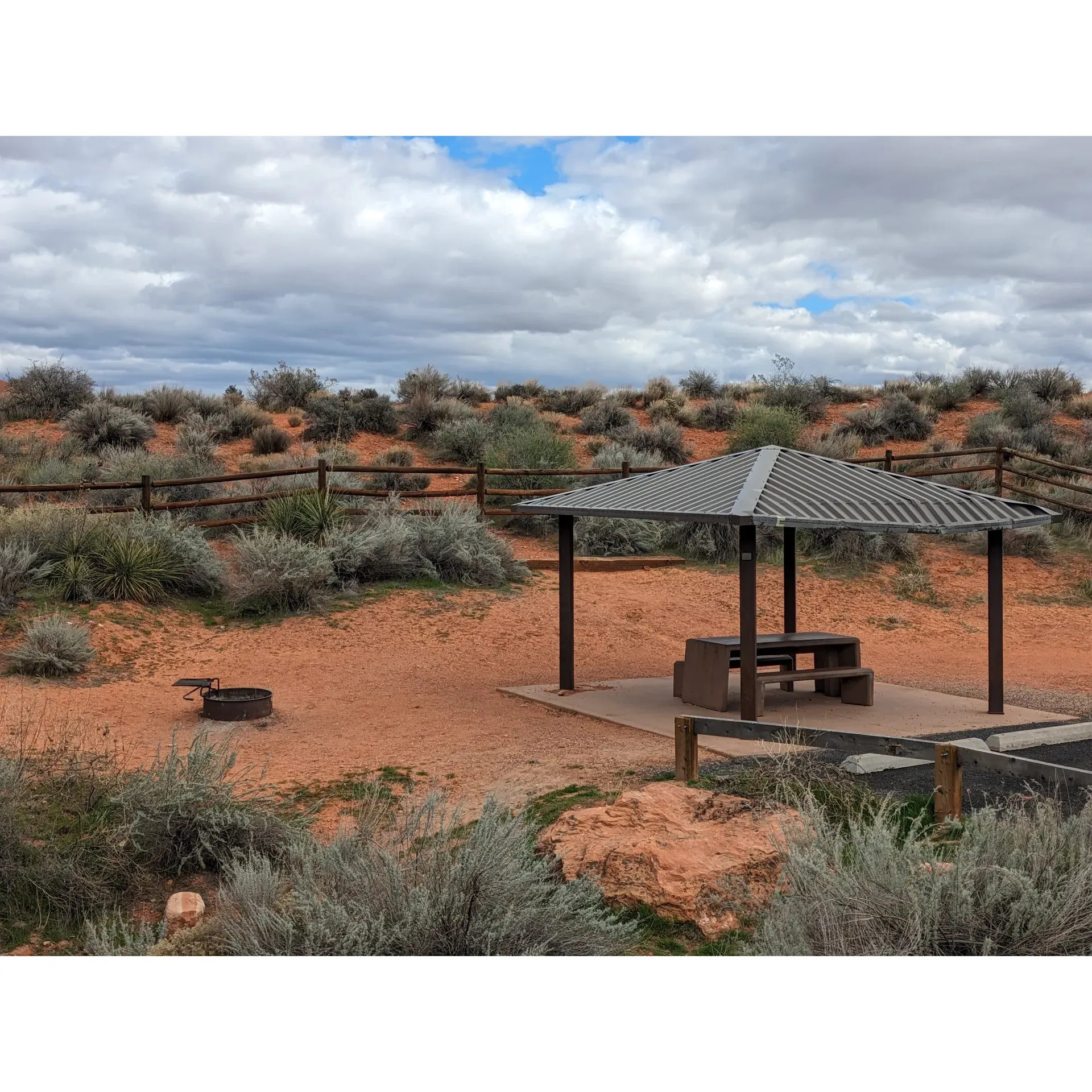 Red Cliffs Campground offers a serene and picturesque outdoor experience ideally suited for nature enthusiasts seeking an escape from the bustle of daily life. With its affordable rates, including discounts for seniors, and a 14-day stay limit, visitors can enjoy the beauty of the campground for an extended period. The presence of convenient amenities such as water spigots, dumpsters, and vault toilets adds to the comfort of your stay. 

Staying connected is easy, as T-Mobile users report a strong cell signal, ensuring guests can share their adventures or stay in touch with the outside world, if they choose. The campground is appreciated for its extensive network of excellent hiking and mountain biking trails, offering a variety of experiences for all skill levels. The emphasis on non-motorized paths means that the area remains tranquil and undisturbed by off-highway vehicle (OHV) noise, providing a pure and peaceful setting.

The campground is also a hub for local day users, who come to enjoy the well-maintained trails that meander through the surrounding landscape. For those in search of a more unique activity, the nearby dinosaur tracks add a touch of history and intrigue to the outdoor adventure. 

Visitors rave about the quietude and the sense of being deep in the great outdoors, with natural flora providing privacy between each campsite. This makes it a perfect retreat for couples or solo travelers looking for solitude or a peaceful retreat. 

Experience the allure of the red rocks with overnight spots that offer a rustic charm, even if they challenge your leveling skills. Just remember to respect the local wildlife and secure your food, as the squirrels and other creatures are part of the campground's natural residents.

Red Cliffs Campground epitomizes a true outdoor getaway, with amenities that cater to your basic needs while immersing you in a tranquil, natural setting. It’s a destination that requires some planning, given its popularity and reservation-only booking system, but with some foresight, campers can secure a spot in this coveted outdoor haven. Description by ChatGPT.