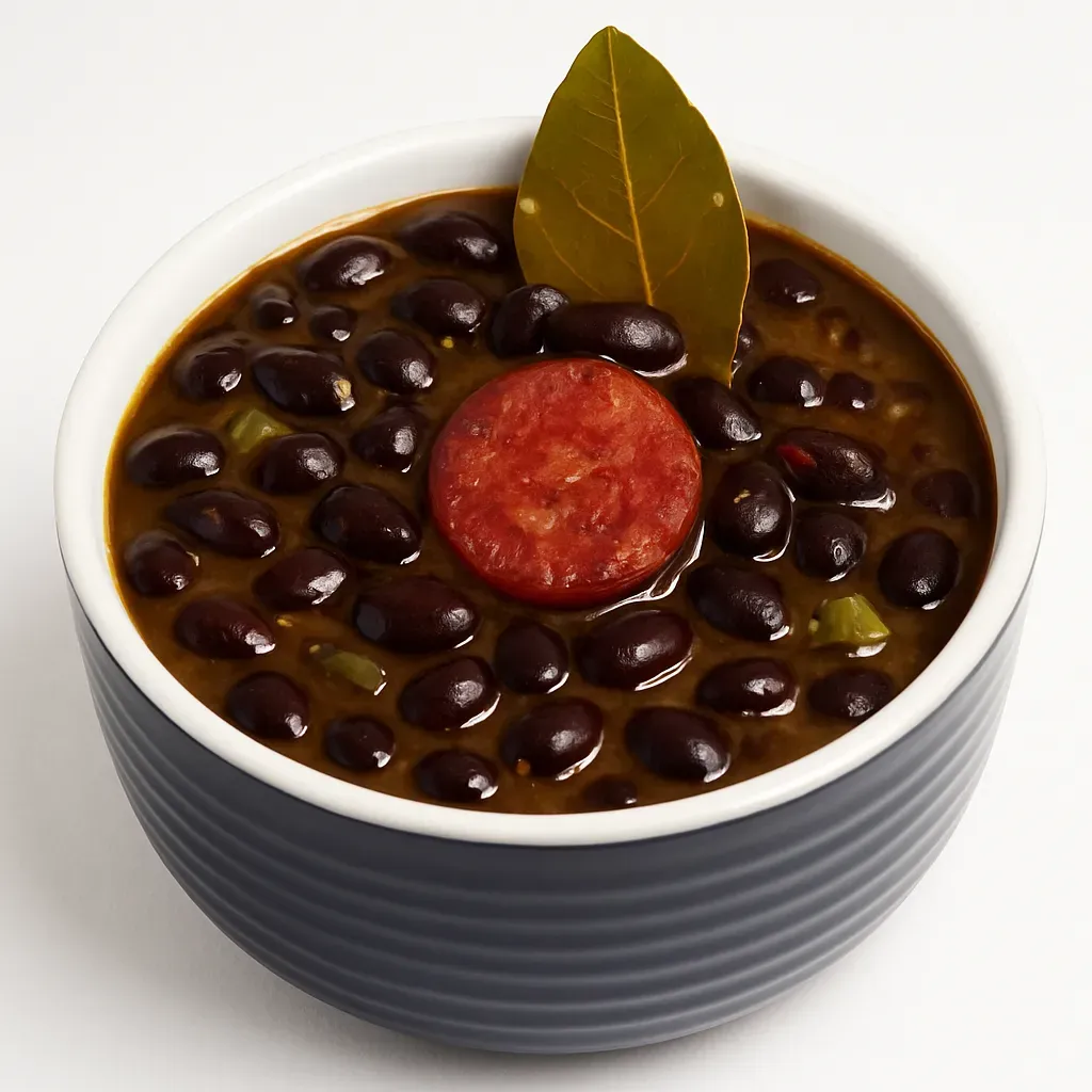 A traditional Cuban recipe featuring tender black beans simmered with aromatic herbs, spices, and optional chorizo for a rich, comforting dish.