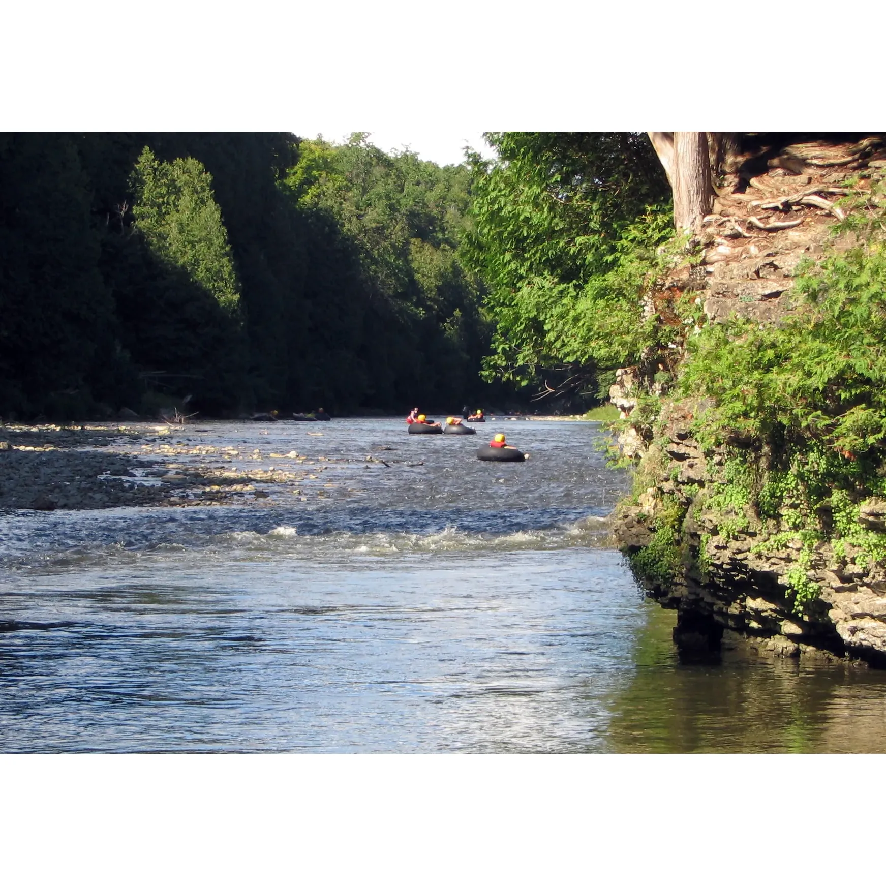 Elora Gorge Conservation Area is an exceptional outdoor haven perfect for families and adventure-seekers alike. This picturesque location invites visitors to partake in an exciting array of activities, with the popular option of tubing down the gentle river, a highlight for many. Boasting a tranquil flow, the river provides a delightful experience, particularly suitable for families with young children, offering an easygoing but thrilling ride for approximately an hour.

Enthusiasts recommend purchasing tickets for tubing in advance and bringing personal equipment such as tubes and helmets to maximize cost-efficiency and convenience. The absence of life guards encourages a spirit of independence as you navigate the serene waters, with some faster currents adding a dash of exhilaration. Along the route, the breathtaking scenery that unfolds includes stunning waterfalls, further enhancing the tubing escapade.

For those keen on terrestrial exploits, three accessible trails await exploration. While the trails may not accommodate strollers, they are gentle enough for an enjoyable walk with kids. Nature lovers will appreciate the chance to immerse themselves in the beautiful landscape and perhaps have a refreshing dive into the inviting water at designated stops.

Practical amenities such as multiple parking lots are available to visitors, although it's advisable to plan your visit considering both the park's entry fee and any potential additional costs for activities like tubing. The conservation area emphasizes natural beauty over commercial facilities, so it's a good idea to pack your own food and water to enjoy a more uninterrupted day with nature.

For extended stays, the RV section offers a serene wilderness atmosphere for camping, with spacious, clean sites that promote an authentic outdoor living experience. Although some amenities like splash pads are a distance away, the overall camping experience is very reasonably priced, and the location's blend of tranquility and recreational opportunities promises a memorable visit.

Visitors often leave not only with cherished memories but also with practical advice for future explorers: wear water shoes, secure your belongings with a waterproof case, and consider bringing ropes to stay connected with friends or family. A liberal application of sunscreen, along with protective gear such as life jackets and helmets, is also recommended to ensure a safe and enjoyable day out.

Elora Gorge Conservation Area, with its stunning natural vistas and exciting recreational possibilities, comes highly recommended by those who have experienced its charm. Whether it’s for a day trip or a longer camping excursion, it is a destination that beckons to be explored and enjoyed time and time again. Description by ChatGPT.