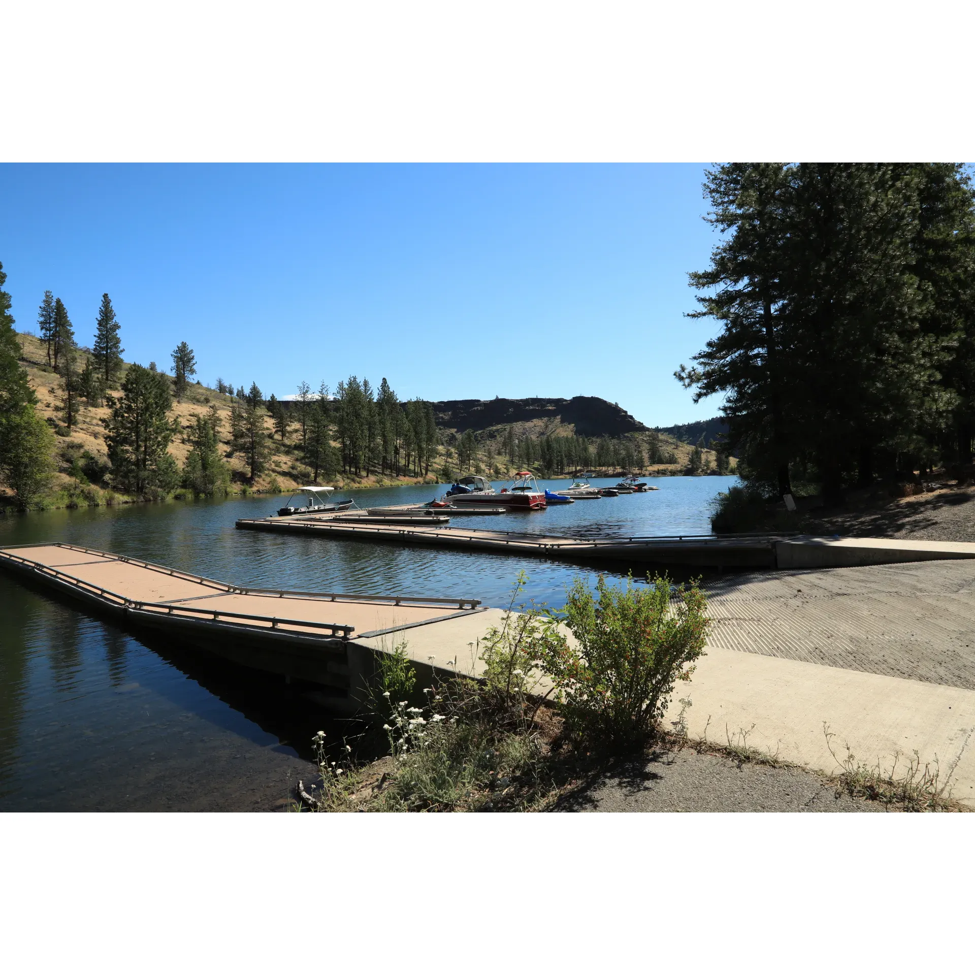 Perry South Campground offers a serene retreat for outdoor enthusiasts looking to immerse themselves in high desert grandeur while providing convenient water access for a host of aquatic adventures. With its strategically divided upper and lower sections, the campground caters to different preferences, with the lower section being a high-demand area thanks to its proximity to the water—perfect for campers eager to experience the buzz of lakeside activity and easily access boats and kayaks.

The upper campground is a favorite for those seeking more tranquility and a little additional privacy. Abundant space at the upper sites allows for a relaxed setting, ideal for families or groups looking to spread out and enjoy multiple tents in one spot. Across both sections, the campground impresses visitors with its top-tier maintenance, from well-raked tent spots to fire rings that beckon for evening marshmallow roasts and stargazing.

Cleanliness and convenience go hand-in-hand at Perry South Campground, where guests frequently commend the impeccably kept pit toilets—rare finds in the great outdoors that demonstrate the hosts’ dedication to comfort. Moreover, the campground's water pumps provide an accessible source of hydration, with the lower campground pump being notably user-friendly.

Boating enthusiasts will appreciate the option to reserve a boat slip, ensuring that adventures on Lake Billy Chinook are seamless and full of exhilarating moments spent water skiing, paddling, or simply soaking in the spectacular scenery. And while some choose to venture to nearby lakes for clearer waters, the opportunities for fishing right at the campground remain a draw, with those holding the appropriate tribal fishing permits enjoying their own slice of angling heaven.

Beyond the water, Perry South promises other natural delights—an idyllic stream meanders through, a quaint dock invites quiet reflection, and the presence of wildlife such as owls and bald eagles adds an element of surprise and awe. For those with a keen eye, the nearby Metolius balancing rocks stand as an easy-to-reach marvel, enriching the overall camping experience.

Camping connoisseurs with four decades of memories at Perry South confirm its status as one of the most beautiful places, a testament to its legacy as a cherished destination. With engaging water sports, relaxing settings, and a tucked-away feel, Perry South Campground remains a top choice for those drawn to the allure of Central Oregon's unique landscapes and outdoor pleasures. Description by ChatGPT.