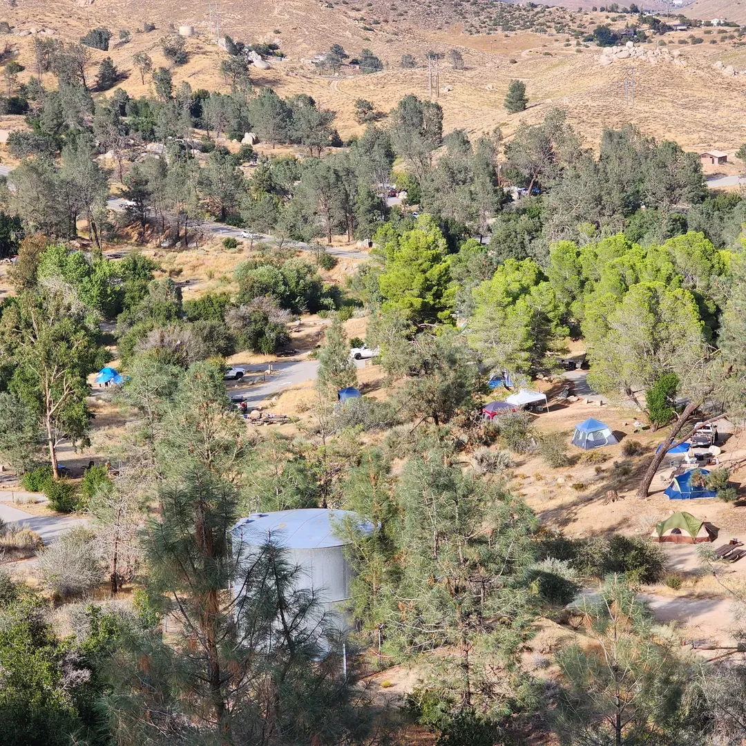 Hungry Gulch Campground offers a rustic outdoor adventure for enthusiasts looking to connect with nature and enjoy the great outdoors. Strategically located with proximity to Lake Isabella, the campground provides an idyllic setting for campers seeking a serene escape with views of the surrounding landscape. 

With facilities that cater to basic needs including running water and restrooms, guests can comfortably settle into the natural terrain. The campgrounds are diverse, offering an array of sites to choose from, each presenting its own unique charm and requiring a dash of creativity to set up the perfect campsite. Sun-lovers will rejoice in the ample daylight that graces many of the sites, though shade can also be found for those looking to lounge in cooler spots.

One of the campsite's highlights is the scenic hiking trail that leads to an old mine and onward to Isabella Peak, providing an excellent opportunity for visitors to soak in breathtaking sunset views over the lake. The approximately 3-mile loop trail strikes the right balance between challenge and enjoyment, with its occasional steep inclines adding to the rewarding experience.

For convenience, the campground is positioned a short drive from a nearby town, offering easy access to additional supplies, such as ice, gas, or food, which ensures that an impromptu camping need never becomes a crisis.

For a friendly and helpful touch, campers can expect informative assistance from the amenable camp host, who is available to ensure guests have an enjoyable stay and maximize their experience at Hungry Gulch Campground. The campground's emphasis on facilitating a tranquil environment, combined with its natural beauty and recreational offerings, makes it a choice destination for campers looking to indulge in a peaceful retreat amidst the wilderness. Description by ChatGPT.