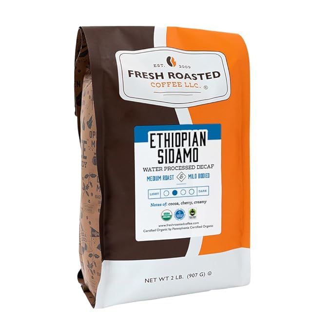 Fresh Roasted Coffee's Fair Trade Organic Ethiopian Sidamo Water Decaf is a premium blend of decaffeinated coffee beans sourced from the Sidamo region of Ethiopia. This 2 lb (32 oz) bag of whole beans is certified kosher and has a medium roast profile, resulting in a balanced and smooth flavor profile.