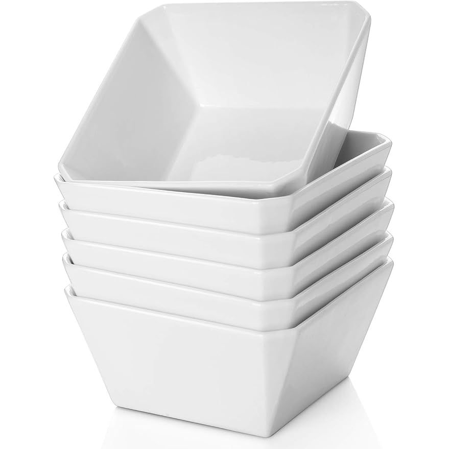 Porcelain cereal bowls in a set of six, each holding up to 16 ounces, are designed to serve a variety of dishes such as salad, soup, snacks, desserts, and marmalade. The square-shaped white ceramic bowls measure 5 inches in diameter, making them perfect for various dining occasions and table settings.