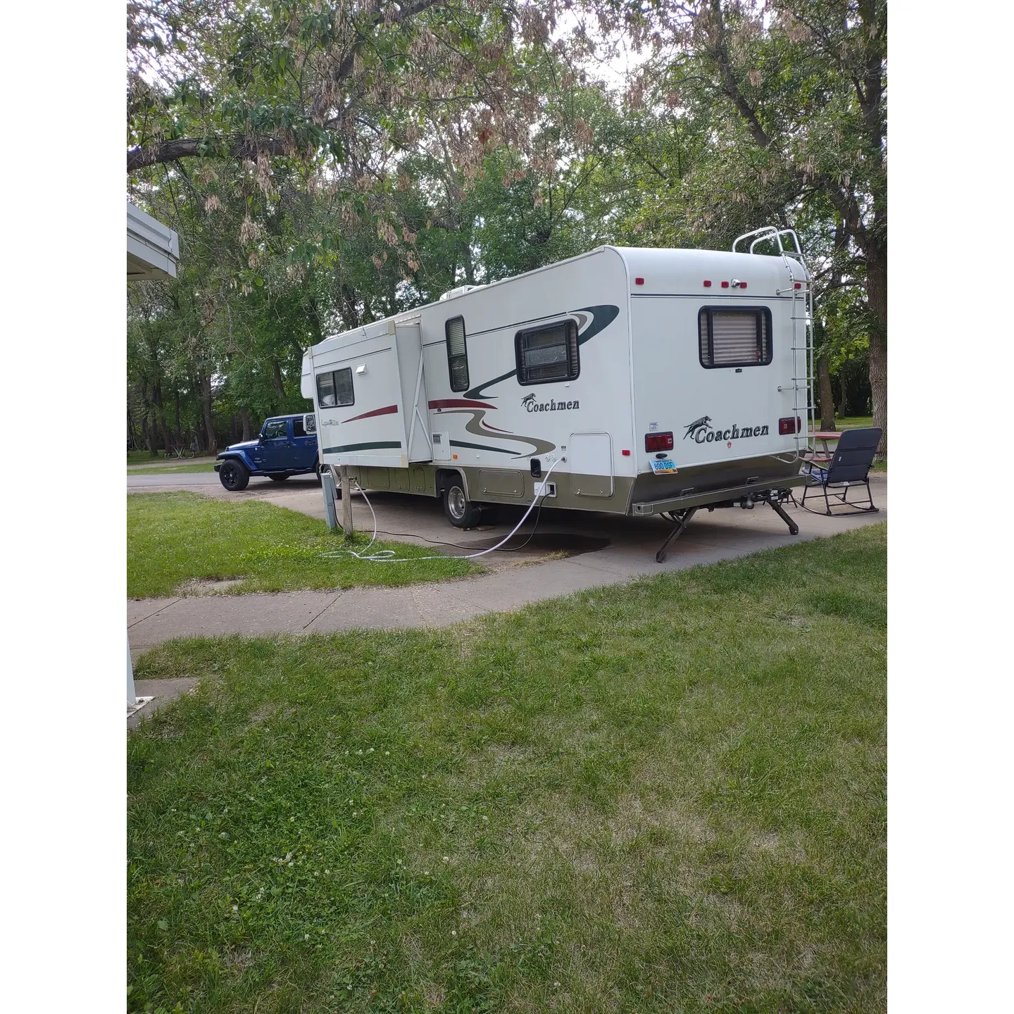 Lakeside Campground is a tranquil getaway offering a serene camping experience amid scenic surroundings. Embraced by lush foliage and conveniently located near a picturesque lake, the grounds are an ideal retreat for nature enthusiasts and families alike. The well-maintained playground is a vibrant hub for children of all ages, with equipment that keeps younger campers delighted and active throughout their stay.

Guests appreciate the campground's peaceful environment during weekdays, providing a restorative escape from the bustle of everyday life. The sites, which are well-shaded by the natural canopy, offer respite from the summer heat and are spacious enough to ensure comfort and privacy. Amenities such as fire rings and picnic tables at each site enhance the outdoor experience, while studio cabins present a cozy alternative for those seeking a more contained lodging option.

Convenience is key at Lakeside Campground, with the layout of gravel back-in sites positioned to facilitate ease of parking for campers. The campground's facilities, including a clean toilet and shower block, are praised for their upkeep and contribute to the overall welcoming atmosphere.

Positioned within a short stroll to the lake's edge, visitors can enjoy the soothing sights of the water, providing a picturesque backdrop for relaxation and contemplation. Moreover, the campground's proximity to the expressway, as well as nearby cultural attractions like the Buffalo Museum and charming local villages, enables guests to enrich their stay with historical and cultural outings.

For those seeking a warm shower after a day full of activities, the facilities provide hot, continuous water, ensuring comfort and convenience. The campground's accommodating staff is responsive and flexible, addressing any shifting needs that arise during one's stay, and the natural proximity to convenient thoroughfares ensures accessibility for those in transit to further destinations.

Lakeside Campground emerges as a favored choice for travelers looking for a serene and uncomplicated outdoor experience, harmoniously pairing the elemental beauty of the great outdoors with the creature comforts and ease that elevates a simple camping trip into a restorative and memorable vacation. Description by ChatGPT.