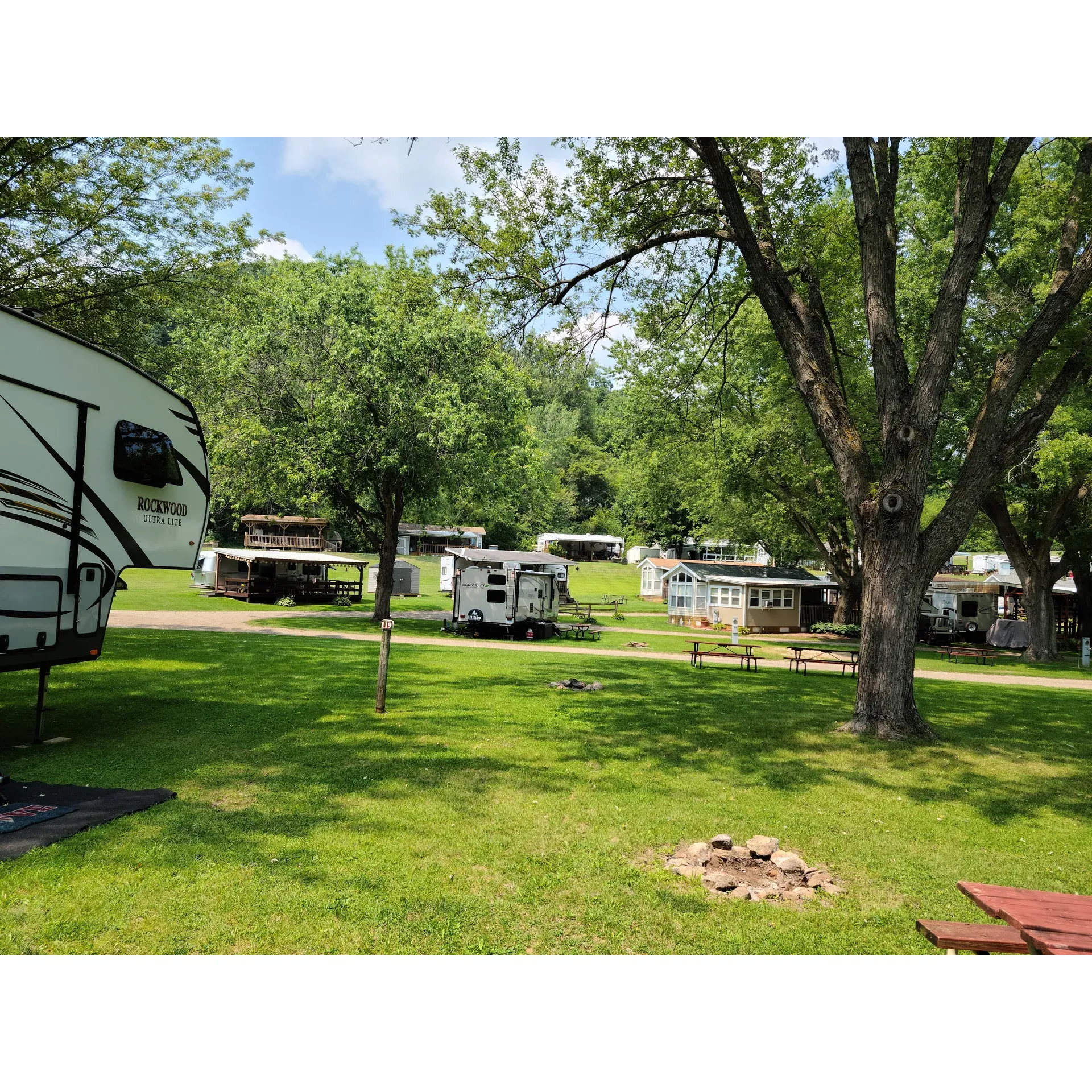 Money Creek Haven, Inc. provides a serene getaway in the picturesque countryside outside of Houston, MN, where nature's beauty is on full display. It offers campers a unique outdoor experience with the luxury of a spring-fed pool that delights families and nature enthusiasts alike. The pool serves as the centerpiece of recreation, surrounded by the lush greenery of the local terrain.

Guests take pleasure in an array of amenities, including delicious ice cream options to beat the summer heat and various snacks conveniently accessible by the poolside. On special weekends, such as Labor Day, Money Creek Haven enhances the camping experience with charming on-site boutiques featuring a variety of goods, ensuring there's something for everyone.

The campground creates an atmosphere perfect for those looking to disconnect and immerse themselves into the rustic charm of camping, with limited internet connectivity encouraging visitors to engage with the environment and each other. The scenic landscape sets the stage for making lasting memories, especially during their annual 4th of July celebration where families gather to enjoy awe-inspiring fireworks displays that light up the night sky.

Money Creek Haven is celebrated for its affordability and welcoming environment, making it a favored destination for both small and large families. With the invitation to indulge in leisure by the pool or enjoy a refreshing beverage while diving into a good read, it's a place that truly embraces the joy of the great outdoors. Whether you're seeking a friendly community atmosphere or a peaceful retreat, Money Creek Haven, Inc. stands out as a delightful choice for an authentic camping experience. Description by ChatGPT.