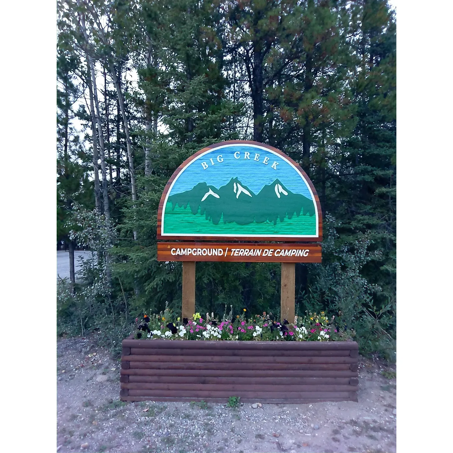 Situated along the legendary Alaska Highway, Big Creek Government Campground is a well-loved oasis for travelers seeking both convenience and natural beauty. The campground offers a variety of spacious sites suited to different types of camping needs, including easy access pull-thru, cozy pull-up-beside, and traditional back-in configurations to accommodate a range of vehicles, totaling about 27 sites. 

Visitors are often delighted by the thoughtfully provided amenities such as a welcoming picnic shelter for communal dining or relaxation, and the essential bear-proof storage lockers, ensuring both camper safety and wildlife protection. The cleanliness of the park is frequently lauded, contributing to an enjoyable and worry-free outdoor experience.

One of the campground's standout features is the picturesque creek that serves as both a serene backdrop and a focal point for guests. Here, one can spend hours immersed in nature’s melody, listening to the soothing sounds of the flowing water, offering a sense of peaceful escape as time flows by unnoticed.

Moreover, the availability of complimentary firewood is a delightful perk that enhances the camping experience, allowing visitors to enjoy the crackling sounds and warmth of a campfire under a canopy of stars. 

The campground's popularity is evident as it tends to fill up quickly each day, suggesting that arriving early is key to securing a spot, especially one right beside the gentle murmurs of Big Creek. Well-kept and inviting, many campers express their intentions to return, having found the campground a very nice spot for a restful overnight stay, a quick, refreshing lunch break, or a longer, leisurely retreat into nature's embrace.

Overall, Big Creek Government Campground is a cherished spot for travelers on the Alaska Highway, offering a harmonious blend of practical amenities, natural charm, and welcomed tranquility. Description by ChatGPT.