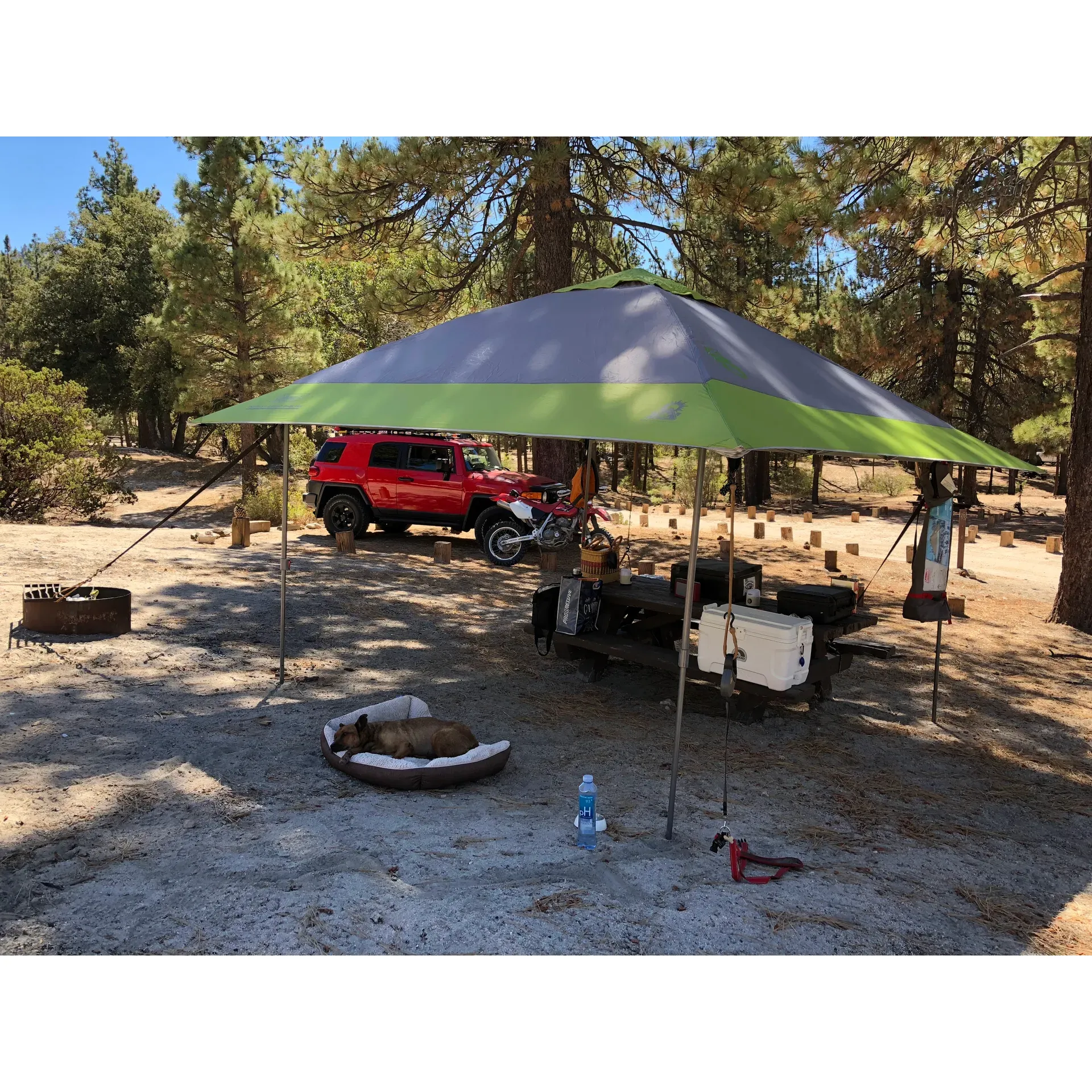 Crab Flats Family Campground offers an exciting off-road adventure just to reach its tranquil grounds, promising a delightful escape into nature's embrace. Adventurous families and thrill-seeking campers praise the journey for its enjoyable challenge that leads to a serene and spacious retreat.

With ample open spaces that are thoughtfully dappled with shade, Crab Flats Family Campground is a haven for those who love the great outdoors. Explorers can delight in the small hikes nearby, clambering over inviting boulders and unwinding in the beauty of the natural surroundings. Visitors highlight returning to experience these joys, solidifying the campground's charm and appeal.

The roomy campsites ensure privacy and comfort, allowing guests to revel in their own piece of the wilderness. Every site comes well-equipped with amenities such as a fire pit, a sturdy table, and a secure locker for storing camping gear. For those looking to immer up in the local terrain, nearby trails beckon hikers, dirt bikers, and ATV riders alike, offering a variety of landscapes to conquer.

Amidst the campground's greenery, a river and small waterfall await adventurers, positioned not far from the sites, perfect for a day of exploration or a serene moment by the water. The area is not only a gateway for off-road enthusiasts but also provides an idyllic backdrop for outdoor activities, ensuring that every visit is rich with new experiences.

For those seeking respite from urban life's fast pace, Crab Flats Family Campground is a coveted hidden gem, offering a quiet enclave that encourages relaxation and nature connection. With facilities like daily cleaned vault toilets, the campground prioritizes guest comfort even while immersed in the rusticity of the outdoors.

This alluring destination calls to outdoor lovers looking for a mix of adventure and solitude under a canopy of trees, all within reach of the scenic byways that lead to nearby attractions like Big Bear. A true paradise for campers, Crab Flats Family Campground holds the promise of cherished memories and entices with the allure of return visits to its peaceful and expansive embrace. Description by ChatGPT.