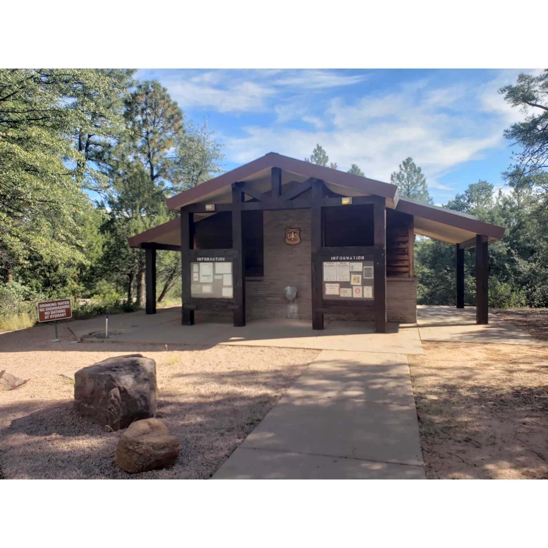 Houston Mesa Campground is a picturesque outdoor escape located just a short drive north of Payson, Arizona—a convenient location that provides the perfect blend of accessibility and wilderness serenity. Set amidst towering pine trees, this campground offers a tranquil retreat for nature enthusiasts and families alike, presenting a variety of spacious and private sites to suit the preferences of all visitors. From the wide, open spaces to the more secluded areas shrouded by trees, guests are sure to find the ideal spot for their camping experience.

The grounds are impeccably maintained, highlighting the park's commitment to cleanliness and attention to detail. The fully functioning flush toilets at Houston Mesa Campground have earned high praise for their immaculate condition, rivaling the cleanliness of fine restaurants and ensuring a comfortable stay. Although showers are currently not available, the excellently kept restrooms more than compensate for this, ensuring that personal upkeep during one's stay is both pleasant and convenient.

Campers have the opportunity to settle into a peaceful atmosphere, where the proximity of nature's beauty is ever-present. Even with the nearby convenience of a main road and the amenities of Payson only moments away—including a full range of services and dining options—the campground retains a distinct sense of isolation, offering a quiet haven where visitors can fully immerse themselves in the great outdoors. The surrounding forest engenders a sense of being enveloped in wilderness, providing a perfect setting for relaxation and outdoor activities.

For those seeking connectivity, cell signal coverage is strong across the campground, enabling visitors to stay in touch with the world outside while enjoying their getaway. Visitors have the freedom to choose from multiple loops, including the Mountain Lion loop, which features immense and secluded sites, allowing for an intimate camping experience.

The friendly and accommodating camp hosts at Houston Mesa Campground ensure that every camper feels welcome and content, contributing to a warm community atmosphere that many guests are eager to return to. With such a well-rounded and accessible outdoor retreat, Houston Mesa Campground is rapidly becoming a favorite for both planned vacations and spontaneous adventures in the heart of Arizona's scenic landscapes. Description by ChatGPT.