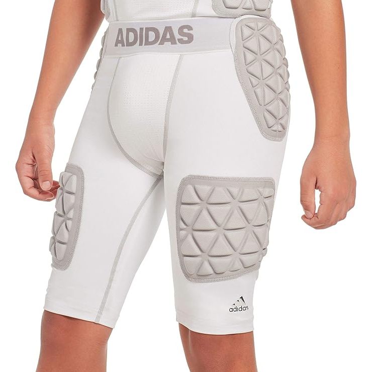 The adidas Youth Techfit 5 Pad Integrated Football Girdle is a protective piece of gear designed specifically for young football players. It features five strategically placed pads to provide targeted protection for the hips, thighs, and tailbone during games and practices.