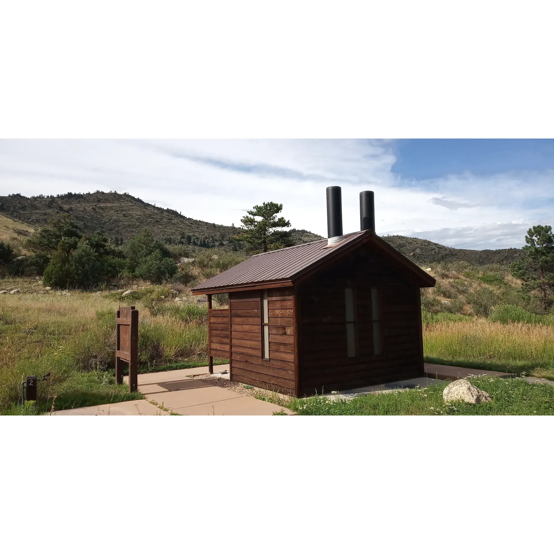 Dutch George Campground is a prime destination for those looking to immerse themselves in the natural beauty and serenity of Poudre River Canyon. Campers are warmly greeted by an opportunity to secure their perfect site on a first-come, first-serve basis, encouraging early arrival to capture one of the enviable spots along the flowing majesty of the Poudre River. 

The campground prides itself on its exceptional maintenance, with reviewers frequently lauding the immaculate condition of the facilities. Strategically placed throughout the grounds, visitors will find tidy bathrooms and convenient disposal sites, ensuring a comfortable and eco-friendly camping experience. An added comfort is provided by the availability of potable water spouts dotted around the vicinity.

For those chilly evenings or storytelling sessions around the fire, the camp host offers firewood at a reasonable price, facilitating that quintessential camping atmosphere. The surrounding landscape boasts breath-taking panorastics, certain to inspire awe in every visitor. Campsites sit upon the banks of the river, offering unparalleled access to waterside joys such as fishing or simply relaxing in a hammock to the soothing sounds of the flowing water.

The campground hosts are known for their hospitable nature, always eager to enhance your stay and ensure a memorable visit. As you traverse the campground's length via the scenic path that closely hugs the water's edge, the sense of peace and spaciousness is palpable—even when the campground is at full capacity, it retains a sense of tranquility without ever feeling crowded.

With 21 well-appointed sites, a commitment to cleanliness, and a no cell signal policy to encourage digital detoxification, Dutch George Campground stands out as an idyllic retreat for those seeking to reconnect with nature and unwind in a picturesque setting. With its affordable rates and additional amenities, it’s no wonder that many consider it their go-to campground for a rejuvenating outdoor experience. Description by ChatGPT.