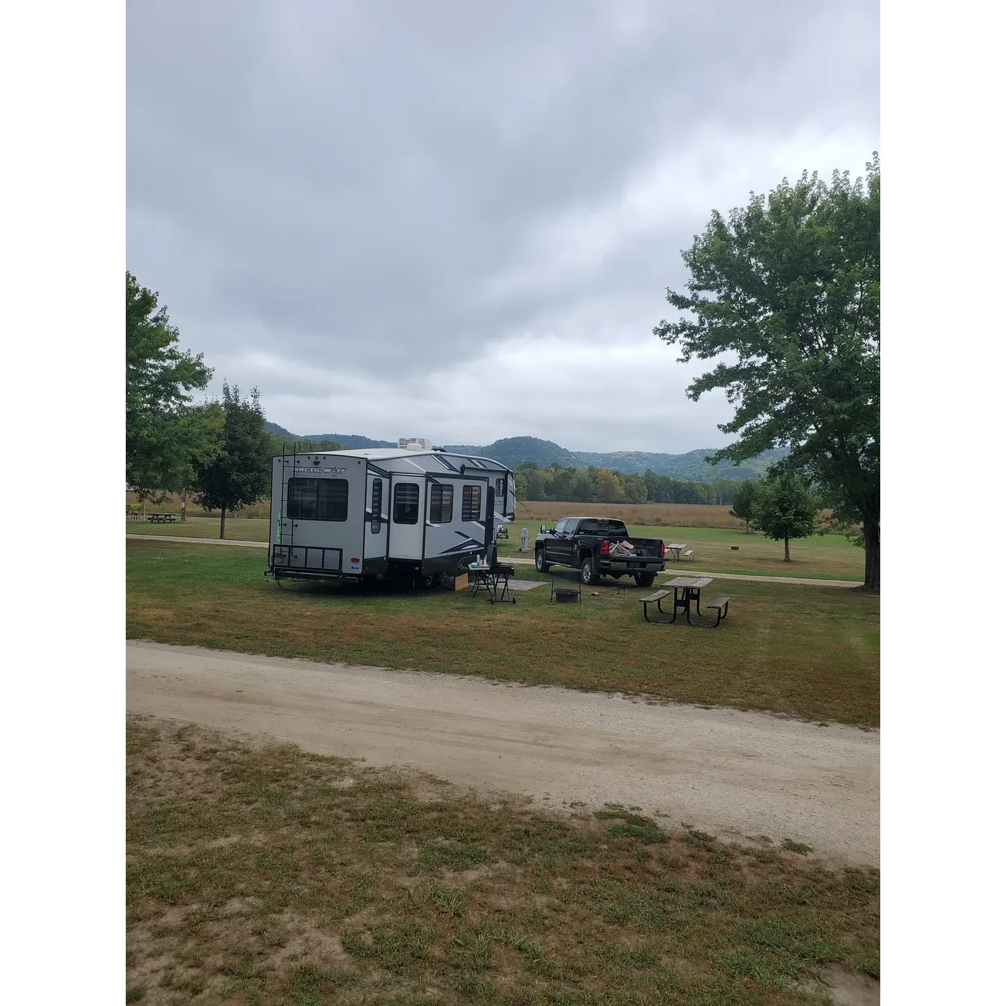 Cushon's Peak Campground offers an idyllic outdoor retreat with a host, Tom, who is frequently praised for his hospitality. This premier campsite is a favored haven for many, some of whom are willing to journey over 4 hours to bask in its welcoming atmosphere. With 50 miles of picturesque asphalt bike trails right at your doorstep, outdoor enthusiasts have endless opportunities for exploration and adventure.

The grounds of Cushon's Peak are meticulously clean and well-maintained, ensuring a comfortable stay for every visitor. The campsite boasts facilities such as spotless bathrooms and delightful nature trails ideal for leisurely walks. Moreover, for those who fancy water activities, the campground offers a seamless canoeing experience, as Tom provides an on-site rental service that adds to the convenience of river trips.

With large and tranquil campsites, guests can soak in the serene outdoor escape Cushon's Peak offers. The campgrounds also feature an outdoor stage, hinting at the possibility of musical concerts and entertainment for guests to enjoy. The versatile stage also provides a perfect platform for children and adults alike to unleash their inner performers.

Situated ideally on a bike path and in close proximity to the local town, visitors have the best of both worlds – the seclusion of nature and the nearby conveniences of urban amenities. For those interested in a longer stay, the possibility of securing a permanent spot adds allure to the campground's long list of appeals.

The campsite is also a great pit-stop for cross-country travelers looking for a relaxing overnight stay. Guests often remark on a sense of relaxation pervading their time at the campground, with the added bonus of friendly fellow campers and the excitement of finding a gateway to the river, perfect for future plans of tubing.

Cushon's Peak Campground stands out as a beautiful and peaceful place, where the dedication to providing an excellent guest experience shines through, thanks in no small part to the commitment of its attentive host. Description by ChatGPT.