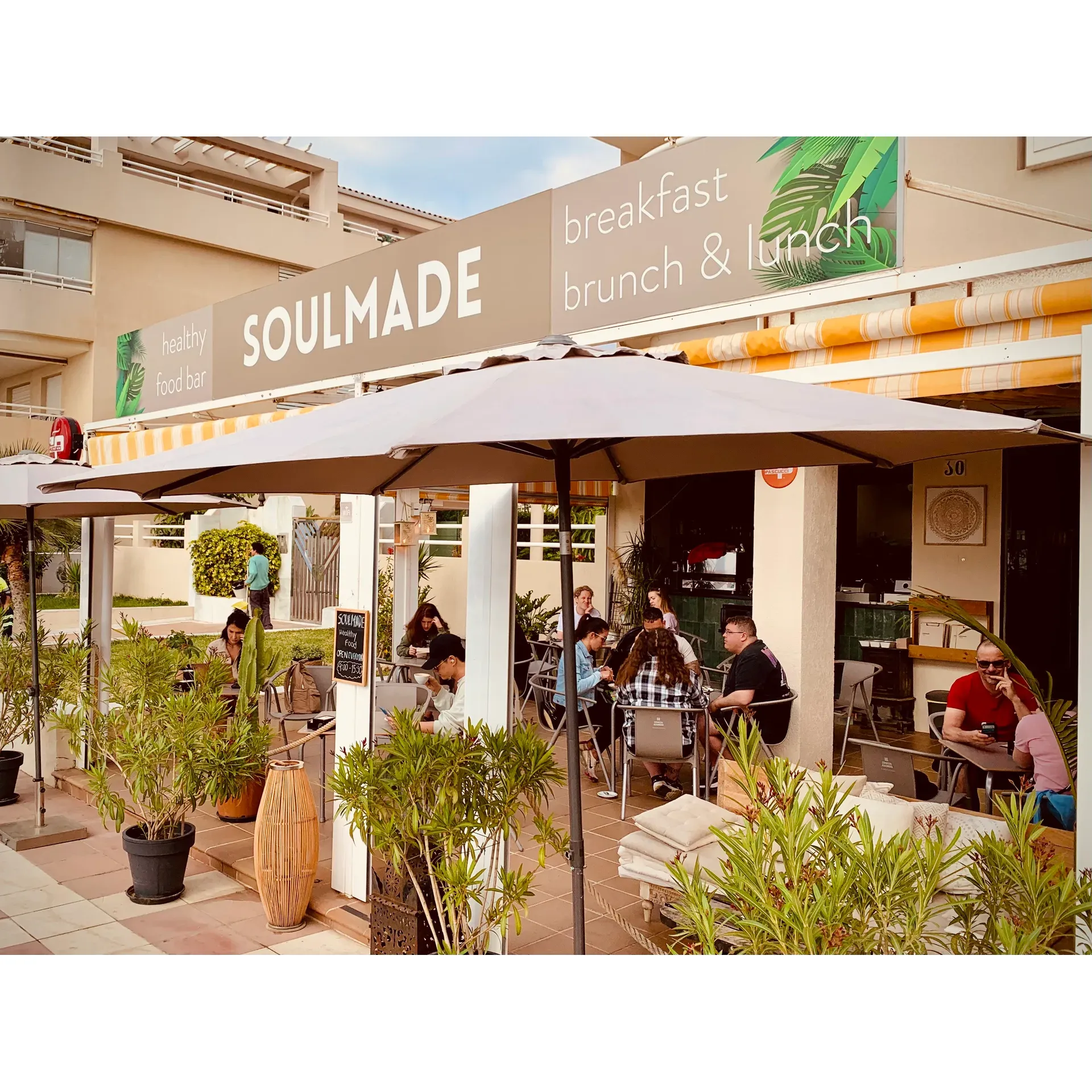 At SOULMADE, you're in for a revitalizing dining experience that brings the best of healthy cuisine to your breakfast, brunch, and lunch table. Whether you're just coming off a serene beach stroll or seeking a tranquil spot to start your day, this delightful healthy food cafe welcomes guests with open arms and a smile.

As you step into this charming and intimate space, the aroma of fresh coffee mingles with the scent of buttery croissants, crafting a warm and inviting atmosphere that complements the gentle seaside ambiance. Known for its prompt and amiable service, you won't be kept waiting as you're eager to dive into a menu brimming with mouthwatering choices that cater to every palate.

Sip on the customer-favorite Ginger Up drink that's packed with zest, or indulge in the variety of delectable drink selections that promise to refresh and energize. The food offerings will leave you both satisfied and inspired, with beautifully crafted dishes that are as nourishing as they are flavor-packed. The croissant dishes, with their satisfying crunch and perfect flakiness, stand out with their generous size and rich flavor, pairing seamlessly with sumptuous scrambled eggs.

For those seeking a vibrant twist on their meal, the açaí bowls are artfully presented, though some guests may find the taste leans toward a natural tartness and freshness. Coffee aficionados and food lovers alike will find something to love here, from "the best avocado & eggs" to smoothie bowls that are as pleasing to the eye as they are to taste. Every visit promises a tasty symphony of healthy, beautifully presented dishes that don't compromise on heartiness.

Located right by the beach, with convenient parking amenities, this cafe has become a cherished spot for both locals and visitors. Its relevance is only enhanced by the selection of great music that punctuates the atmosphere, creating an environment perfect for making lasting memories. SOULMADE comes highly recommended for anyone desiring a deliciously healthy meal in a serene setting, truly a gem that many wish they had discovered sooner. With unforgettable food and a friendly vibe, this cafe is not just a meal destination but an experience that speaks to the soul. Description by ChatGPT.