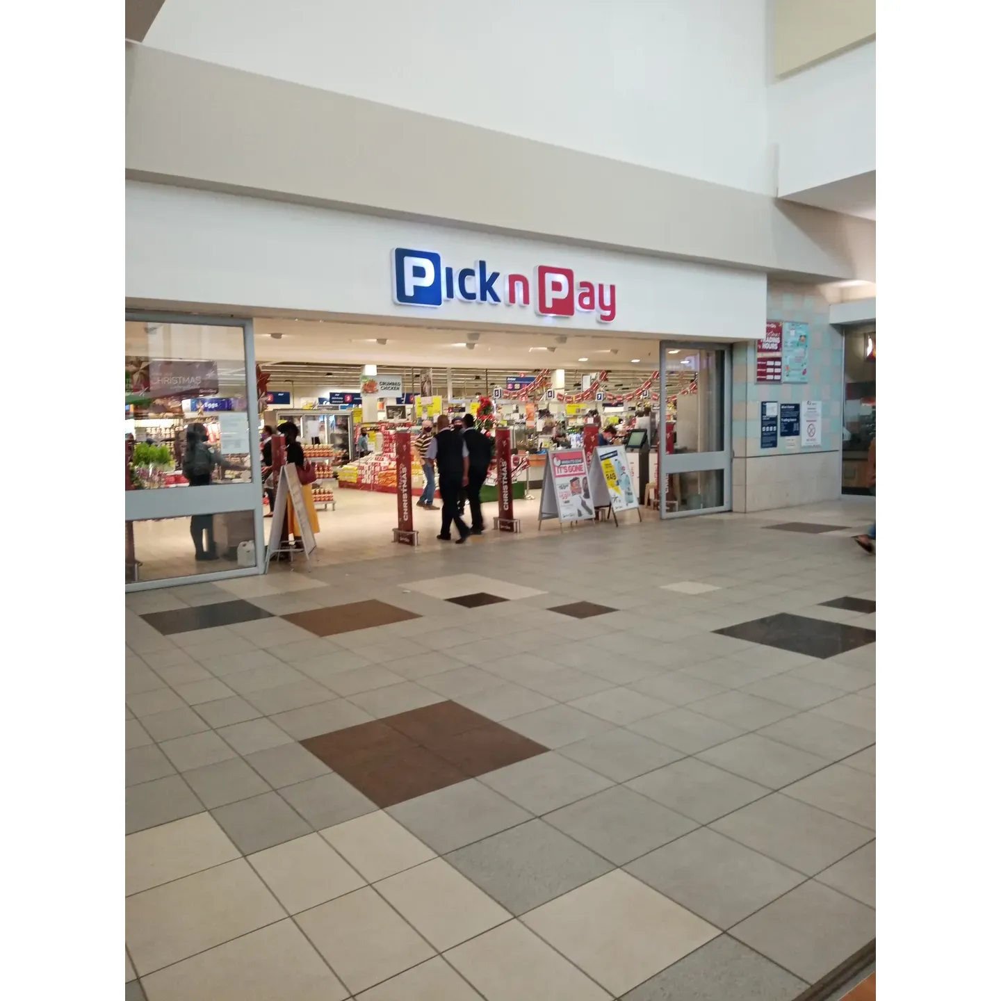 Pick n Pay stands out as a preferred shopping destination known for its impeccable cleanliness and organizational mastery that enhances the overall shopping ambiance. Welcoming shoppers with aisles of meticulously arranged products and ample space, the store creates a seamless shopping journey that allows customers to navigate with ease and convenience.

Famed for their attentive and respectful staff, Pick n Pay ensures every visitor is greeted with a smile and provided with assistance whenever needed, fostering a hospitable and friendly environment. The dedication to customer service is visible through the thoughtful packaging of products and the efficient checkout process which is designed to minimize wait times, offering a swift and pleasant transactional experience.

As a part of a high-quality mall, Pick n Pay enriches its surroundings by offering a nice and neat space that complements the premium feel of the shopping center. Even when faced with temporary issues, such as offline card machines, the store's charm and the politeness of its workers consistently deliver satisfaction to its clientele.

Through a commitment to maintaining a welcoming, tidy, and customer-focused atmosphere, Pick n Pay continues to be a reliable choice for shoppers seeking a relaxed and dignified grocery shopping experience. Description by ChatGPT.