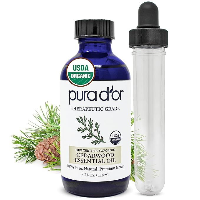 PURA D'OR ORGANIC Cedarwood Essential Oil is a 100% pure and natural therapeutic grade essential oil that comes in a 4oz bottle with a convenient glass dropper for easy application. This versatile oil can be used for a variety of purposes including hair care, skin care, aromatherapy, relaxation, massage, and even DIY soap making.