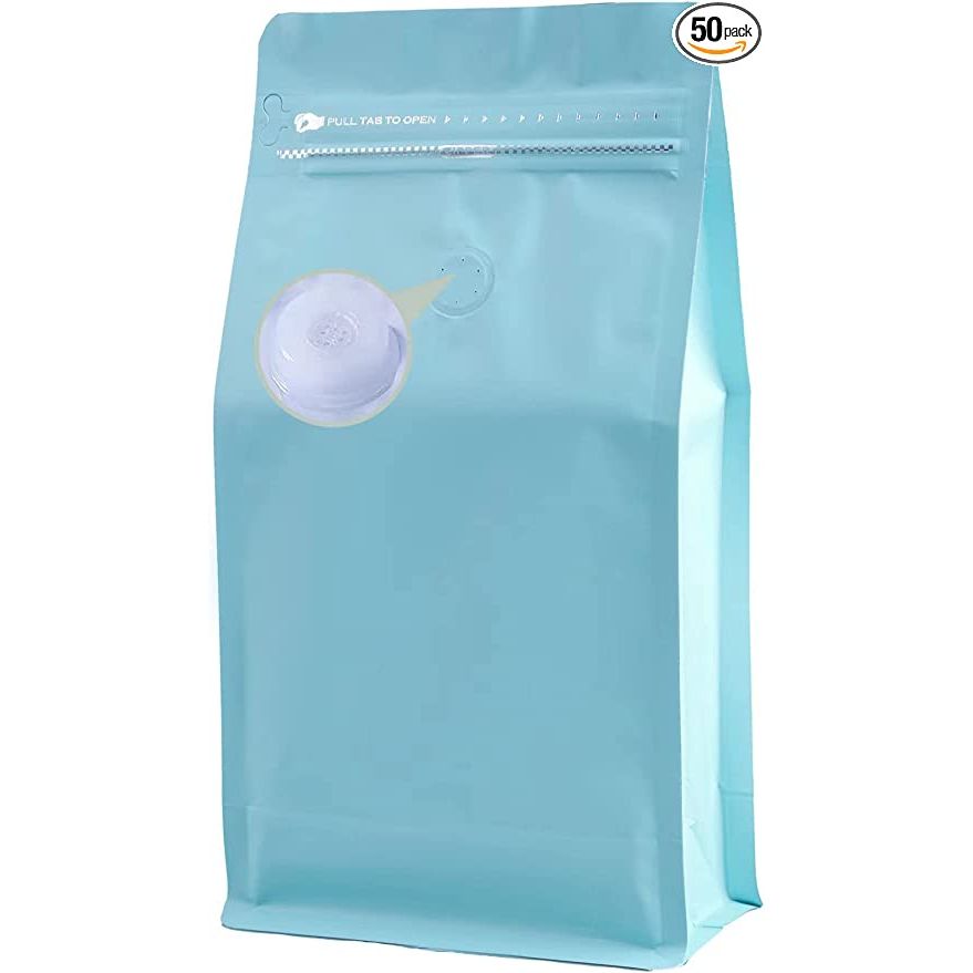 DMPACKDM Coffee Bags with Valve offer a practical and efficient packaging solution for coffee beans. Available in 12 oz, 3/4 lb, and packs of 50 pieces, these bags are made of a blue high barrier aluminum foil material that effectively blocks out moisture, oxygen, and light.