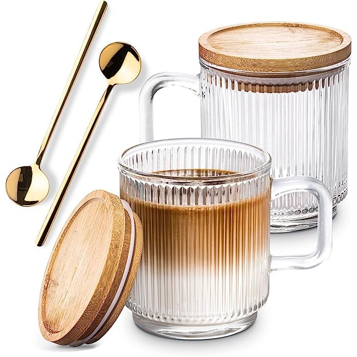 Combler Glass Coffee Mugs are the ultimate must-have for coffee aficionados who crave both style and functionality. With this set of two clear glass coffee mugs, complete with lids and spoons, you can enjoy your favorite hot beverage wherever you are – be it at home, in the office, or at your favorite local coffee shop.