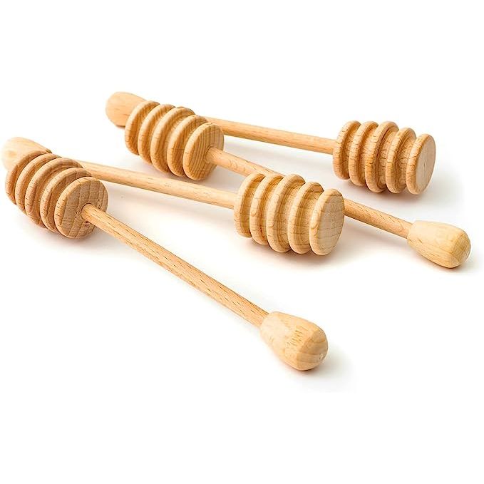 Introducing Tuuli's All-Around Wooden Honey Dipper, the must-have accessory for honey and syrup lovers. Crafted from durable beechwood, this honey spoon is designed for perfection. Its versatile nature allows it to double as a drizzle stick, ideal for maple syrup, melted chocolate, caramel, and more.