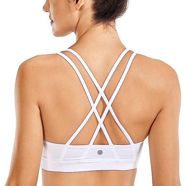 CRZ YOGA Women’s Fitness Workout Yoga Bra Strappy Sports Bras are designed to provide women with maximum comfort and support during their workouts. Made with high-quality materials, these bras are ideal for yoga, Pilates, running, or any other physical activity.