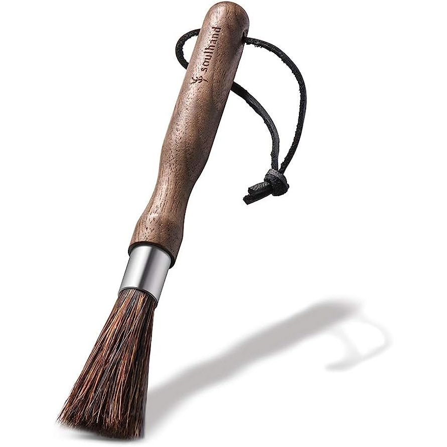 Introducing the Soulhand Professional Coffee Brush, the ultimate cleaning tool meticulously designed for coffee enthusiasts and baristas to ensure a flawlessly clean coffee grinder. Crafted with premium natural bristles, this brush effectively eliminates stubborn coffee residue without leaving any unsightly scratches.