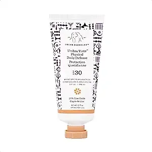 Experience the double-duty beauty of Drunk Elephant's Umbra Tinte™ Physical Daily Defense SPF 30, where skincare meets sun care. This must-have 60 mL tinted moisturizer not only delivers powerful SPF 30 protection with its broad-spectrum formula but also enhances your skin's natural tone with a sheer, universally flattering tint.