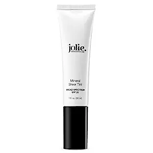 Experience a flawless complexion with Jolie Mineral Sheer Tint SPF 20 Oil Free, your all-in-one solution for daily hydration, subtle coverage, and sun defense. Perfect for those who prefer a minimalist makeup routine, this lightweight tinted moisturizer not only enhances your natural skin tone but also provides the added benefit of SPF 20 protection, safeguarding your skin from the detrimental effects of UVA and UVB rays. Its 'medium' shade option caters beautifully to a wide array of skin tones.

Formulated for a sheer and luminous finish, Jolie's Mineral Sheer Tint SPF 20 offers a barely-there feel while delivering essential sun safety. It's an armor against early signs of aging and environmental damage, thanks to antioxidants like vitamins A, C, and E. Moreover, the inclusion of soothing aloe vera ensures your skin is nurtured and comforted, reducing redness and inflammation. With consistent use, bask in a youthful glow that's not just makeup deep, but also a reflection of well-cared-for skin.

Beauty meets responsibility with Jolie's cruelty-free and vegan formulation, serving as an ethical choice for conscious consumers. Free from oils and harmful chemicals, the Mineral Sheer Tint SPF 20 is your go-to for sensitive skin, guaranteeing a serene experience without compromising on performance. Effortlessly blendable, this moisturizer allows you to achieve your desired coverage seamlessly, promising an eco-friendly and natural addition to your beauty regimen. Embrace the elegance of healthy, protected, and radiant skin daily with Jolie's cutting-edge, eco-conscious product.