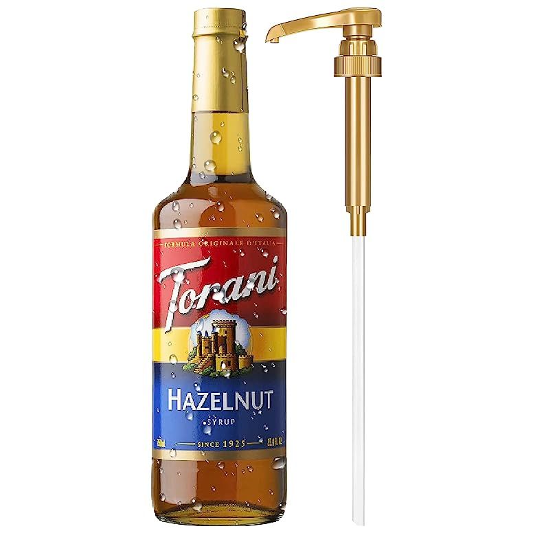 Discover the irresistible taste of Torani Hazelnut Syrup with our convenient Little Squirt Syrup Pump. Perfectly crafted to enhance the flavor of your favorite beverages, this popular syrup is a delightful addition to coffee, tea, cocktails, and desserts. In a generous glass bottle size of 750ml (25.