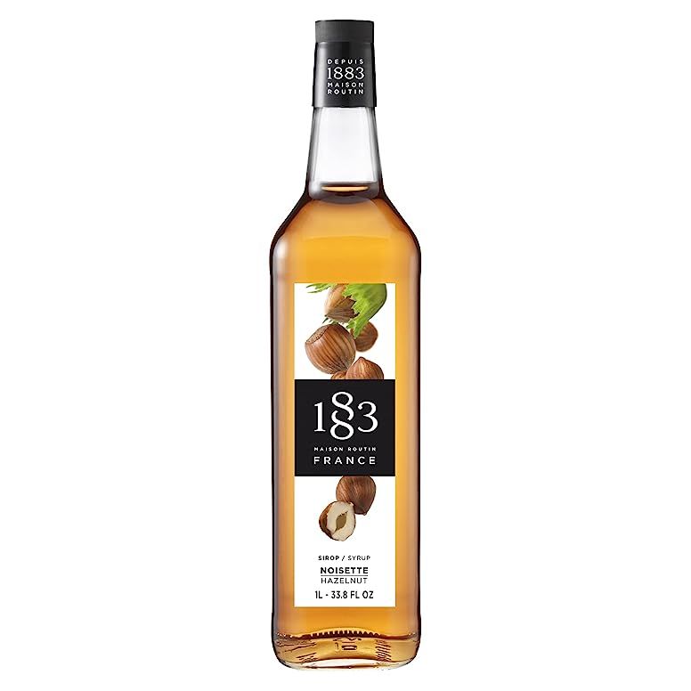 Indulge in the delectable taste of hazelnut with the 1883 Hazelnut Syrup. This irresistible flavored syrup is a must-have for any hazelnut lover. Whether you prefer your beverages hot or cold, this syrup has got you covered. Simply add a splash to your coffee, latte, cappuccino, or any other drink of your choice for a delightful nutty flavor boost.