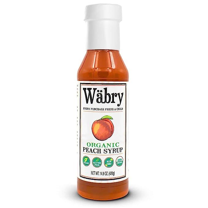 Wäbry Organic Peach Syrup is a delightful, all-natural fruit syrup crafted from the finest, organically grown peaches. Packaged in a convenient 14.9oz (420g) BPA-free plastic bottle, this syrup is a versatile addition to your kitchen, enhancing the flavor of everything from drinks to desserts.