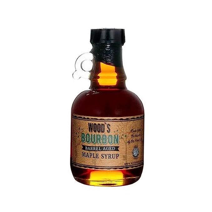 Indulge in a tantalizing experience with WOODS VERMONT Bourbon Barrel Aged Maple Syrup. Combining the distinct flavors of bourbon and maple syrup, this exquisite treat is crafted by aging pure Vermont maple syrup in oak bourbon barrels. Immerse your taste buds in a harmonious blend of sweet maple and robust, smoky bourbon.

This bottle of WOODS VERMONT Bourbon Barrel Aged Maple Syrup contains 8.45 ounces of premium goodness. It is meticulously produced using Grade A Vermont maple syrup, derived from the sap of maple trees in the region renowned for its exceptional quality.

Through a careful aging process in oak bourbon barrels previously used for aging bourbon, this syrup attains its distinctive flavor profile. Resting for months, the syrup gradually absorbs the enchanting notes of oak and vanilla from the bourbon.

The versatility of WOODS VERMONT Bourbon Barrel Aged Maple Syrup knows no bounds. Whether drizzled over fluffy pancakes, crispy waffles, or delectable French toast, it elevates any breakfast delight. Additionally, it adds a delightful touch of sweetness and smokiness to cocktails, marinades, and glazes.

Each bottle of this premium syrup is crafted in small batches to ensure uncompromising quality and is elegantly packaged in a glass bottle, perfect for gifting or displaying on your breakfast table.

In summary, WOODS VERMONT Bourbon Barrel Aged Maple Syrup is a sensation you simply must experience if you crave the splendid marriage of sweet and smoky flavors. Its one-of-a-kind complexity will leave a lasting impression, and the dedication to small-batch production guarantees an exceptional product with every purchase. Description by ChatGPT.