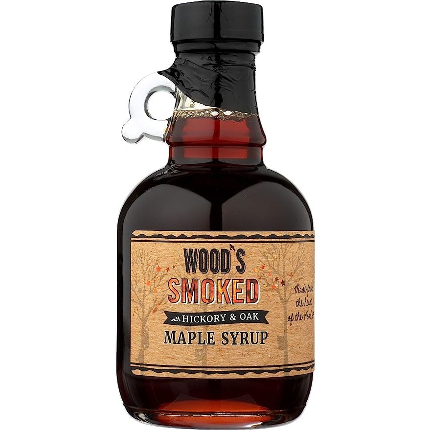 Woods Vermont presents an exquisite creation in the form of their Hickory & Oak Smoked Maple Syrup. Expertly crafted by the Woods Vermont Syrup Company, this syrup is a true testament to the flavors of the Green Mountain State.
