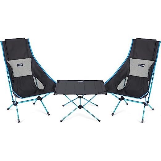 Helinox Table One Hardtop + Two Chair Twos is a combination set designed for outdoor activities such as camping, backpacking, and picnics. This versatile and durable set offers a comfortable seating solution paired with a sturdy table.