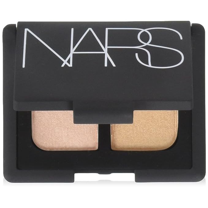 Discover the secret to captivating eyes with the NARS Eye Color Duo Eyeshadow in Alhambra - an indispensable tool for any beauty routine. This chic, travel-friendly compact is the perfect companion for on-the-spot beauty enhancements or achieving that glamorous, professional look at home. Complementing every skin tone, the duo's shimmering beige sets the stage for a subtle, eye-enhancing canvas, while the rose gold shade brings depth and drama, ready to dazzle on any occasion. Each shade's exquisite velvety texture allows for a glide-on application and effortless blendability, giving you the creative freedom to wear them alone or mixed for a custom creation. Unleash the full potential of your eyes with the NARS Eye Color Duo Eyeshadow in Alhambra—your ticket to eye makeup perfection.