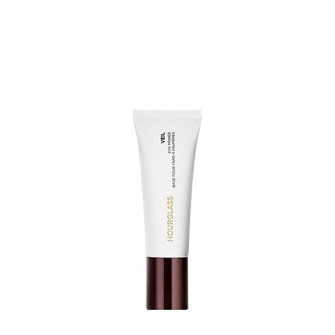 Elevate your eye makeup game with the transformative Hourglass Veil Eye Primer, an essential resource for beauty aficionados seeking to ensure their look remains impeccable all day. This luxurious primer is a game-changer, crafting a perfect canvas on your eyelids that boosts eyeshadow vibrancy, combats creasing, and secures longevity.