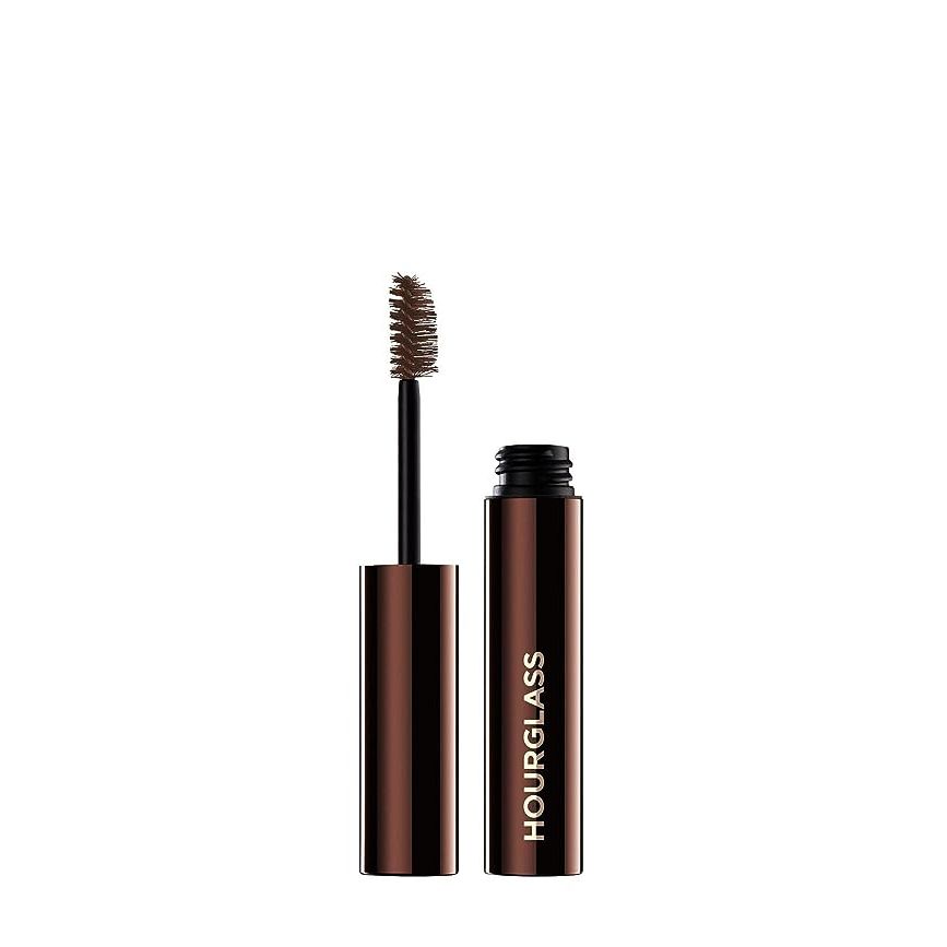 Elevate your beauty routine with the illustrious Hourglass Arch Brow Volumizing Fiber Gel, a premium eyebrow enhancer revered by beauty aficionados across the globe. Catering to the discerning tastes of those who seek refined and voluminous brows, this warm brunette-tinted gem is the secret to achieving impeccably full and defined brows.