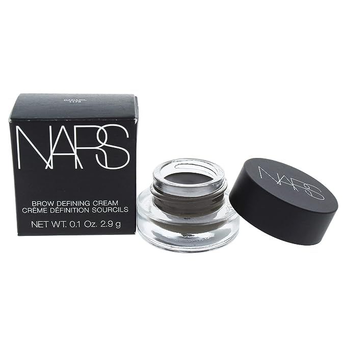 Elevate your eyebrow game with the exquisite NARS Brow Defining Cream in Danakil, a formidable ally in the artillery of beauty enthusiasts worldwide. This avant-garde formula, available in a feather-light 0.1-ounce container, is meticulously engineered to shape and define your brows with remarkable precision and ease.