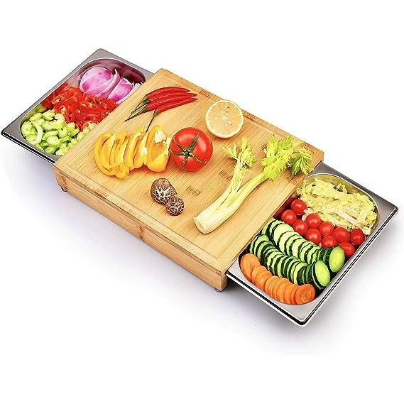 The WEHOME Bamboo Cutting Board with 2 Stainless Steel Trays is a must-have addition to any kitchen. Crafted from natural bamboo, it guarantees durability and reliability for all your cooking endeavors. What sets this cutting board apart is its ingenious design, featuring two stainless steel trays that conveniently slide out from beneath the board.