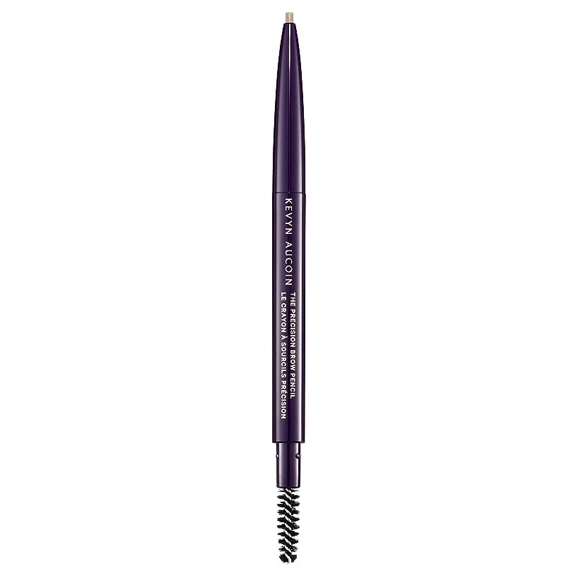 Craft the perfect brows with our elite Precision Brow Pencil in Ash Blonde, a must-have for the beauty aficionado. Designed for impeccable precision, the ultra-fine tip allows for the artful drawing of individual hairs, delivering natural-looking, defined brows with ease.