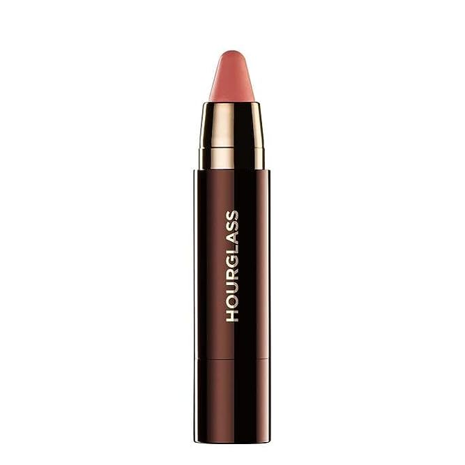 Transform your lip routine with the revolutionary Hourglass Lip Stylo, an exquisite blend of the nourishing care of a balm and the impactful pigment of a lipstick. Revel in the perfection of a kissable, long-lasting finish, courtesy of its plush formula designed to hydrate and gently plump. The ease of a twist-up applicator ensures a sharp, refined look with no fuss or mess. The chic, streamlined pen channels a professional vibe, allowing you to sculpt the ideal silhouette for your lips with enviable precision.