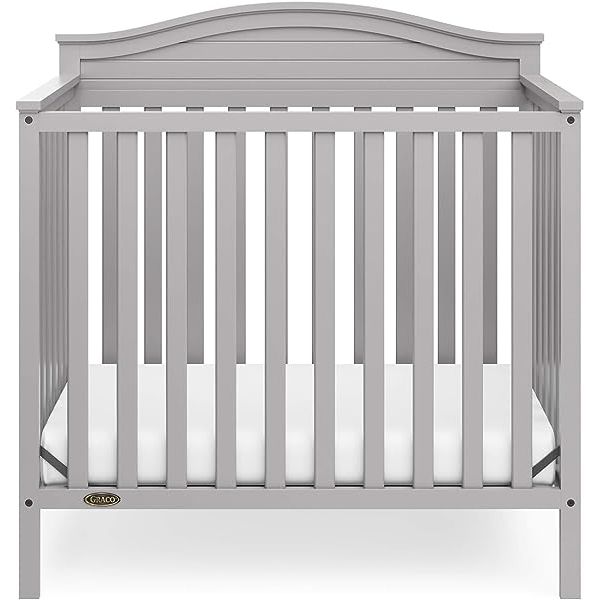 Introducing the 4-in-1 Convertible Mini Crib with Mattress Included, a versatile solution for your growing child's bedroom. This crib effortlessly converts from a mini crib to a daybed and even a twin-size bed with headboard and optional footboard (conversion kit sold separately). With the included 2.