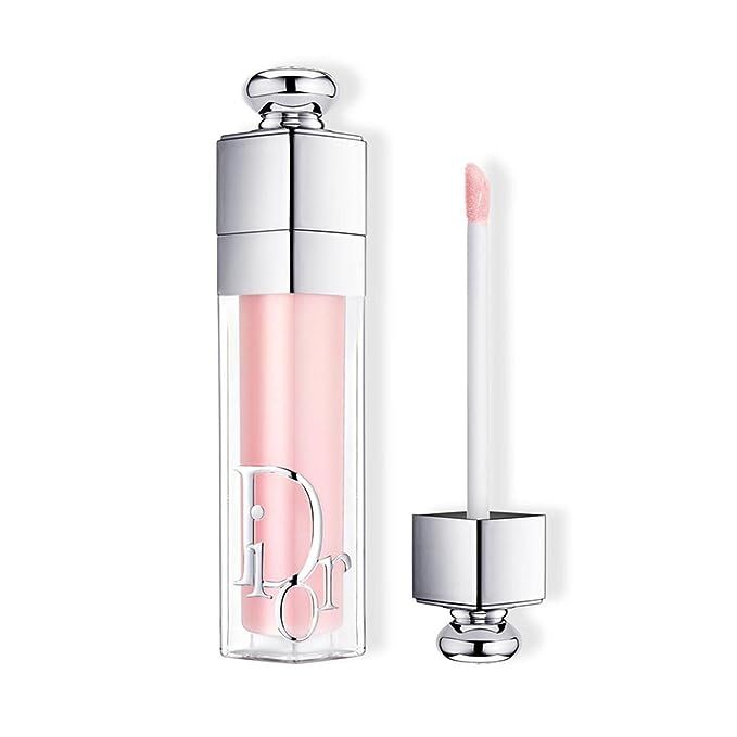 Elevate your lip game with Dior's exquisite Addict Lip Maximizer Plumping Gloss in the chic 001 Pink shade. This 6mL beauty must-have is not just a gloss—it's a fusion of fashion and skincare by the esteemed house of Dior. Specially designed to deliver a voluptuous plump, it envelops your lips in a nurturing blend of hyaluronic acid and collagen, ensuring luxurious moisture and a fuller pout with each swipe.

Immerse yourself in the sheer elegance of 001 Pink—a delicately balanced shade that gracefully flatters a wide range of complexions. The Dior Addict Lip Maximizer is your secret weapon for an effortlessly polished look, whether applied solo for a natural shimmer or paired with your go-to lipstick for added dimension and shine. This iconic lip enhancer not only boosts volume but infuses a subtle yet captivating color that’s perfect for any occasion.

Experience the union of practicality and opulence with Dior's Addict Lip Maximizer, thoughtfully presented in sleek, carry-friendly packaging. The innovative foam-tip applicator promises impeccable application, gliding on with precision and ease to coat your lips in a rejuvenating, glossy veil. Choose Dior's Lip Maximizer Plumping Gloss in 001 Pink for an instant dash of luxe and the promise of a more voluptuous smile.