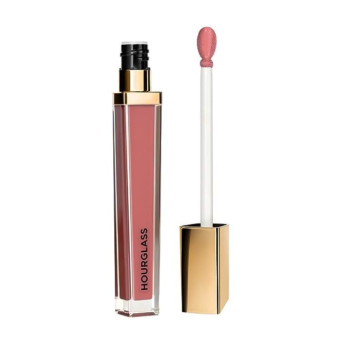 Achieve mesmerizingly full and lustrous lips with the Hourglass Unreal High Shine Volumizing Lip Gloss. Elevate your beauty routine with this coveted lip gloss that promises a high-impact, glossy finish, ensuring your lips are the star of the show.