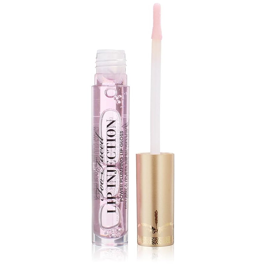 Elevate your lip look with Too Faced's Lip Injection Power Plumping Lip Gloss, the ultimate beauty staple for fuller, irresistible lips. Designed by the esteemed Too Faced design house, this high-performance gloss not only delivers instantaneous plumping effects but also fits seamlessly into your life with its purse-friendly 0.14-ounce size.