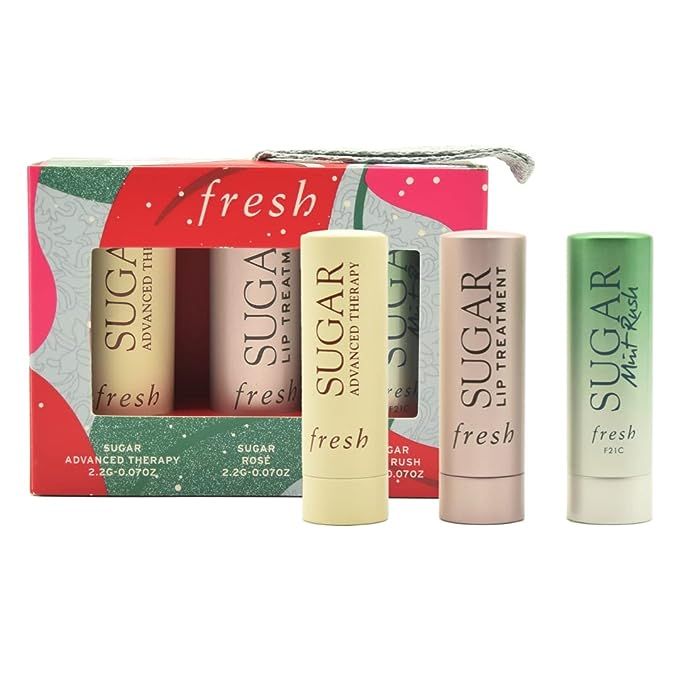 Introducing the To-Go Essentials, a three-piece set perfect for those on-the-go moments. This limited-edition set includes the Sugar Mint Rush Freshening Lip Treatment, the Sugar Advanced Therapy Treatment Lip Balm, and the Sugar Rosé Tinted Lip Balms. Experience all-day moisture and color with these must-have essentials.